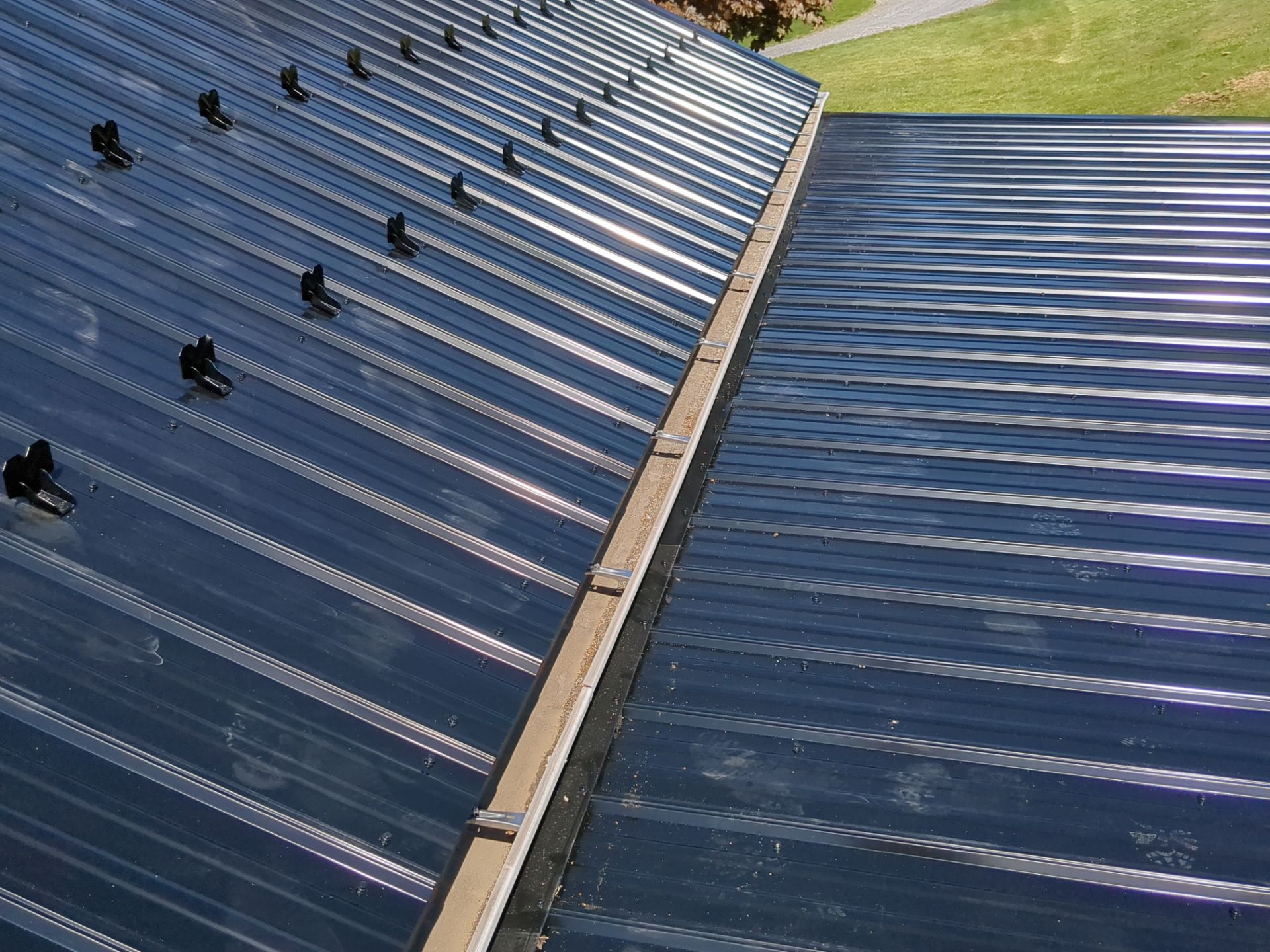 Black ABM Metal Roof Replacement  by Esh Builders