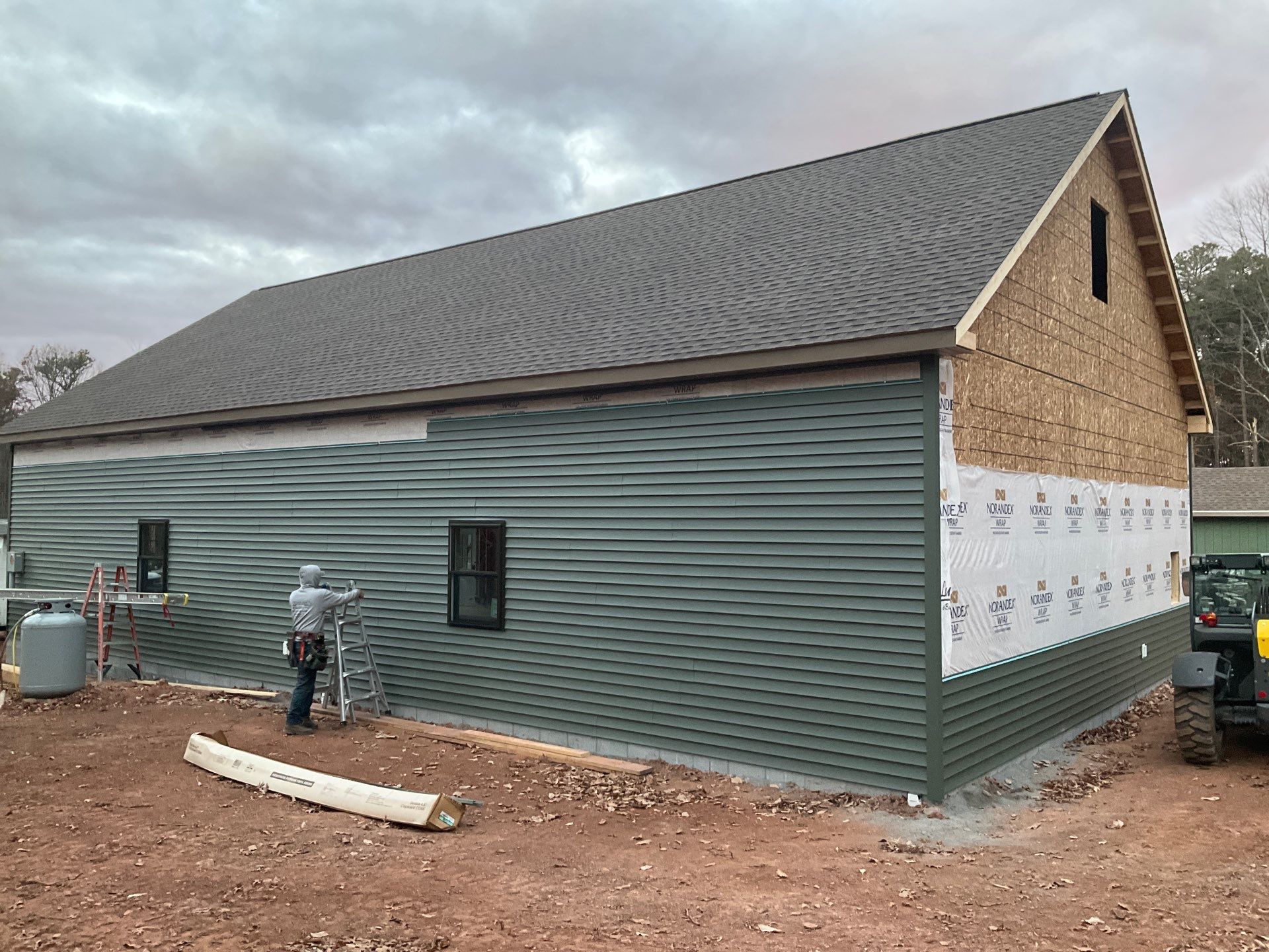 Custom Two-Story Garage with Finished Upper Leve by Esh Builders