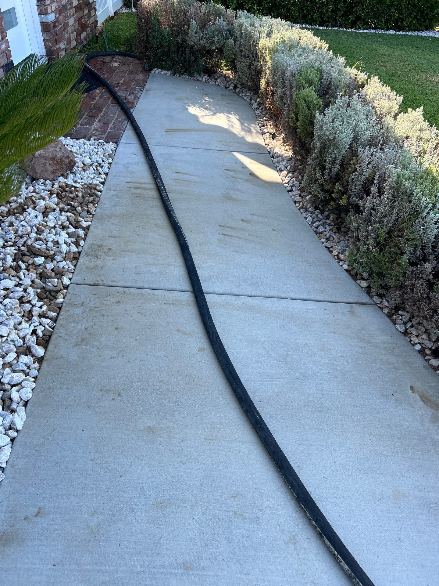 Sandblasting Paint Off Concrete Driveway In Downey, CA by La Power Washing Inc