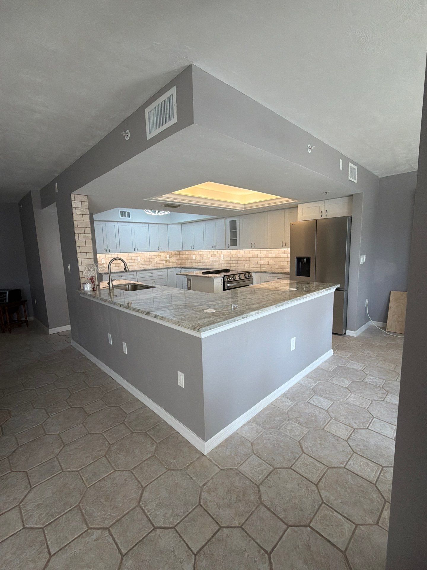 Completely Re-imagined Modern Condominium Kitchen Remodel  by Acies Renovations