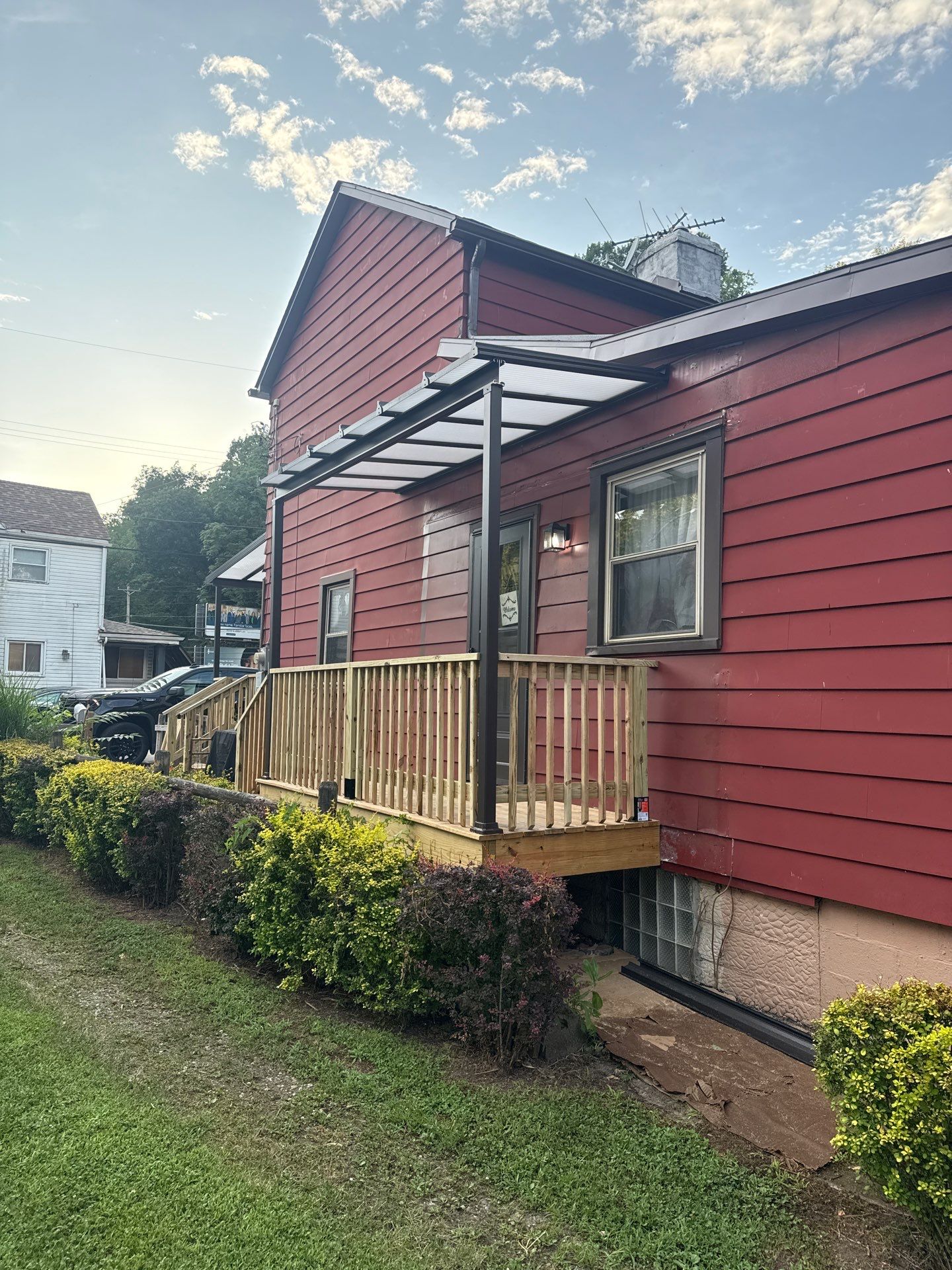 Roof sunspace deck  by Cousins Roofing Siding & Decks