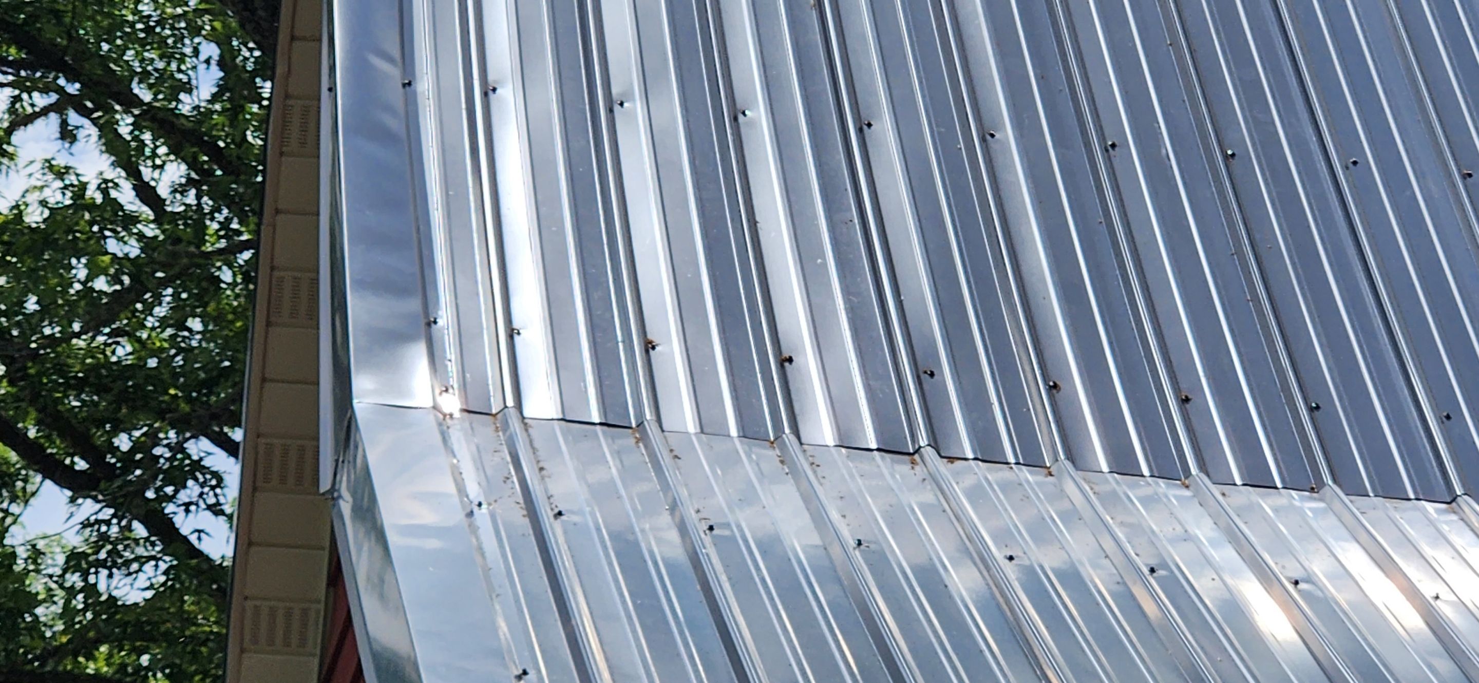 Residential Roofing Installation using 26 Gauge Colored Panels by Hostetler Roofing