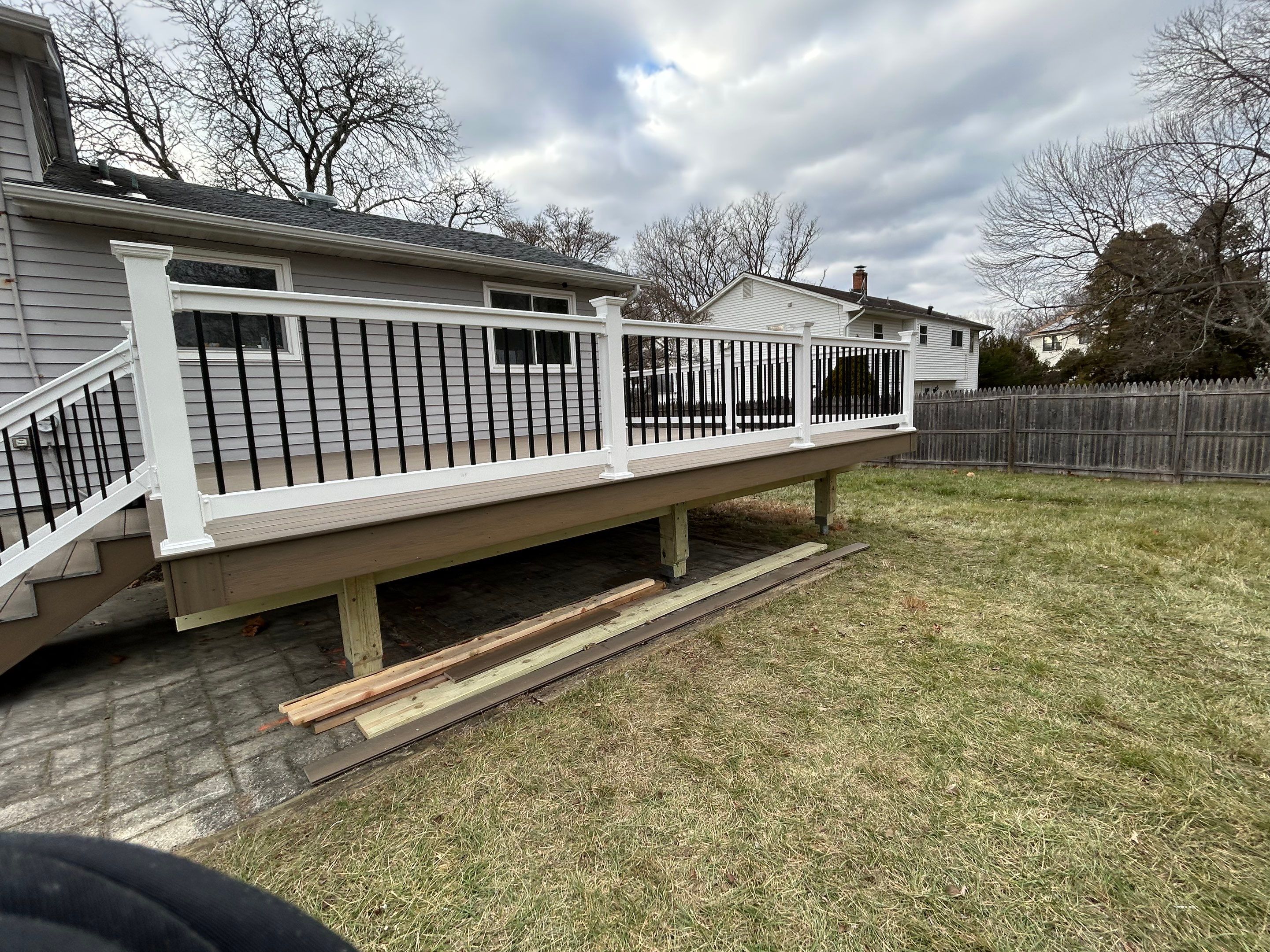 New deck construction and replacement of window with new sliding door  by deck guardian
