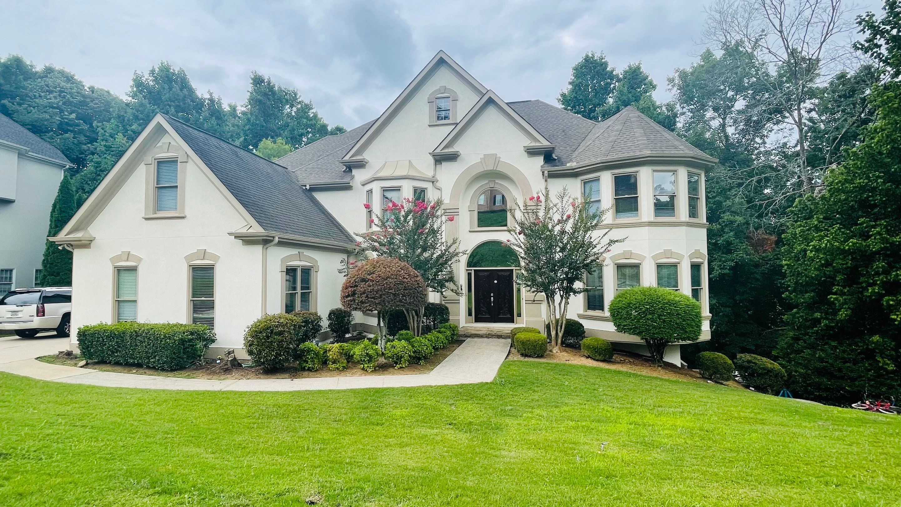 Stucco Exterior Painting and Deck Refinishing in Duluth by Swift Home Renovations