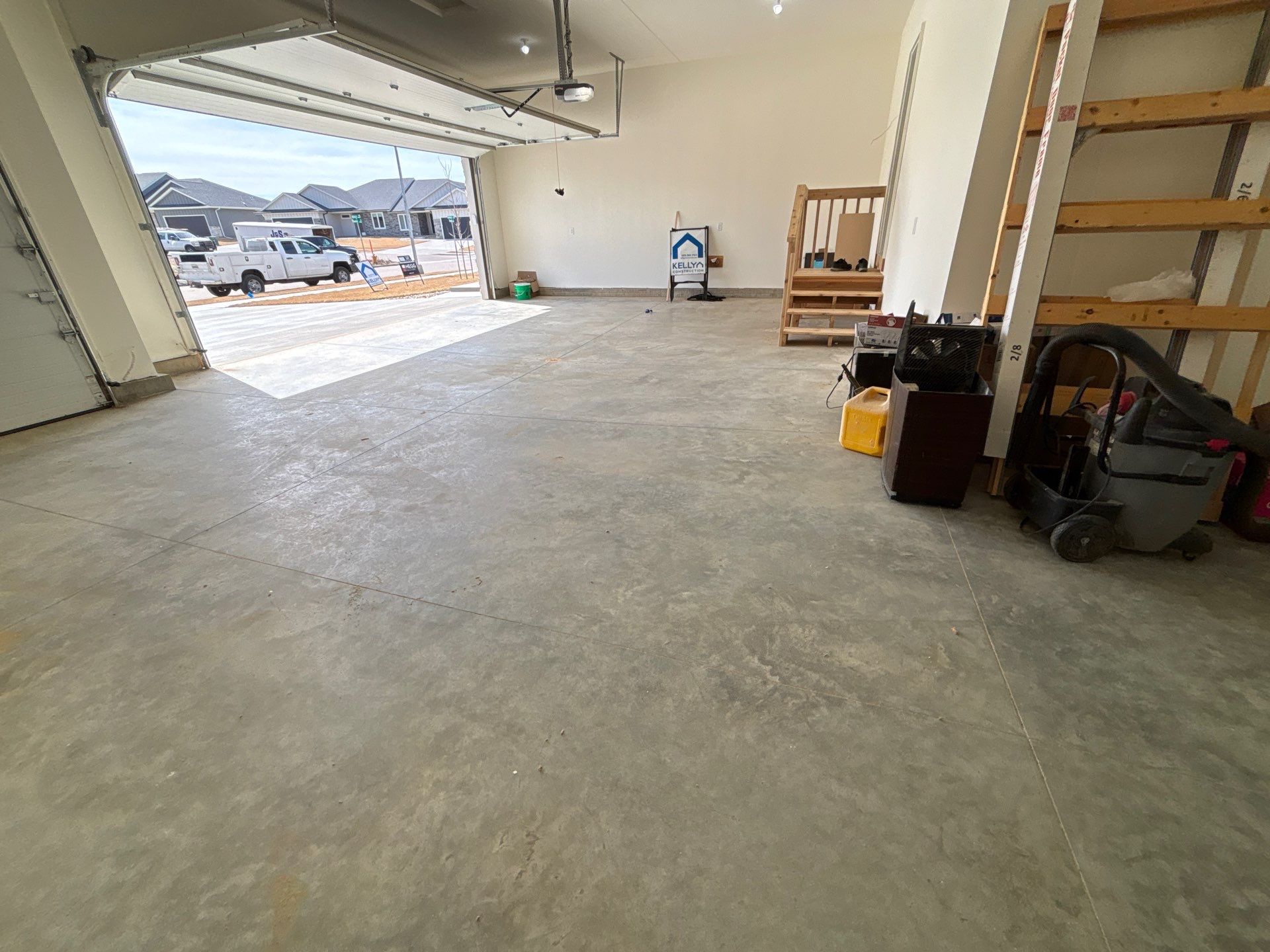 Sioux Falls Garage Floor Transformation with Gray Decorative Flake Coating by Select Painting, Coatings & Garage Cabinets