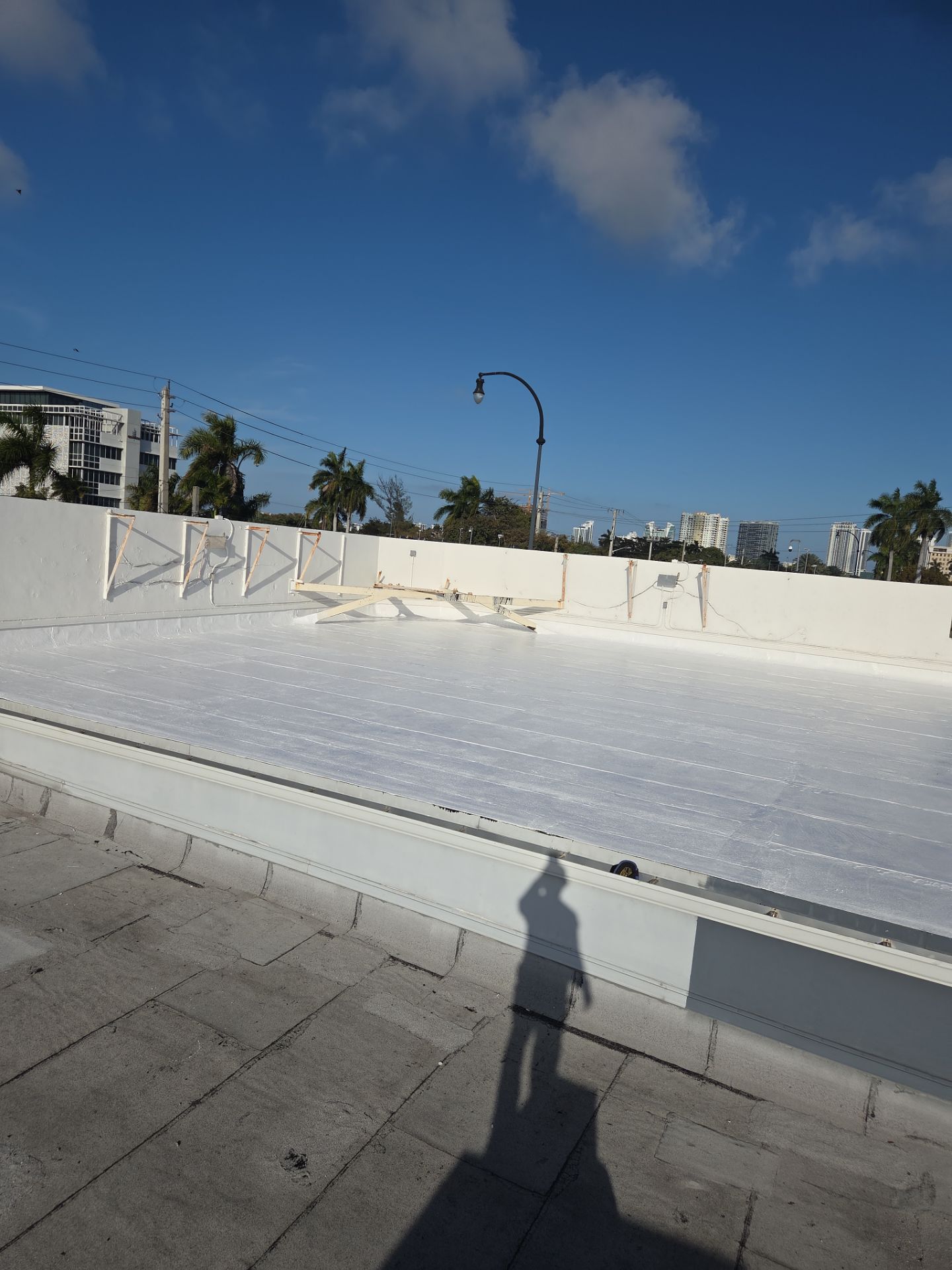 Commercial Flat Roof Restoration Using Silicone Coating in Hallandale Beach by Aastro Roofing