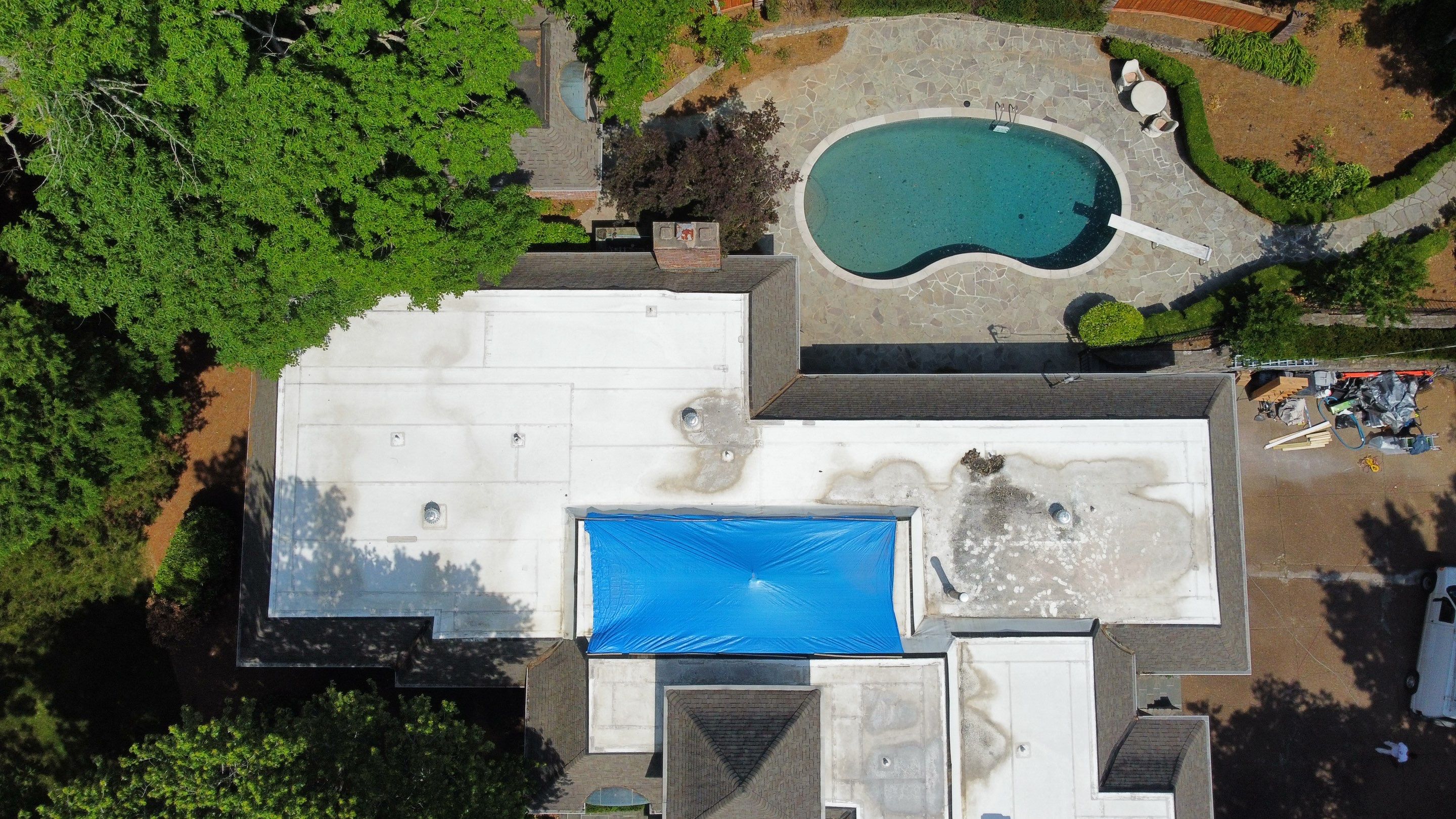 Residential Roofing Installation using Certainteed Belmont Shingles and TPO by Undersun Roofing 