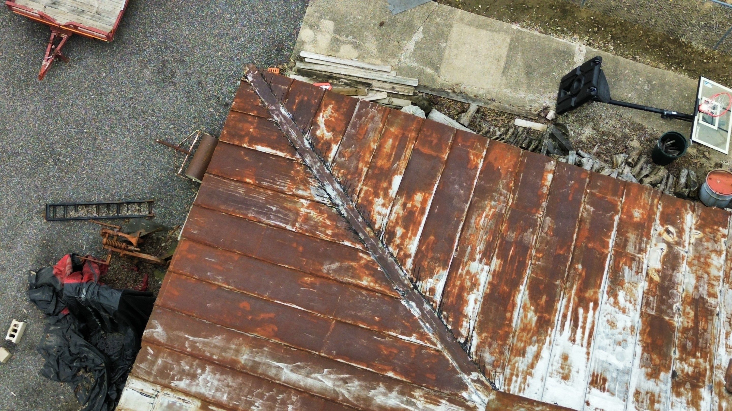 Residential Roofing Installation using Standing Seam Metal - Barn Red by RoofX 