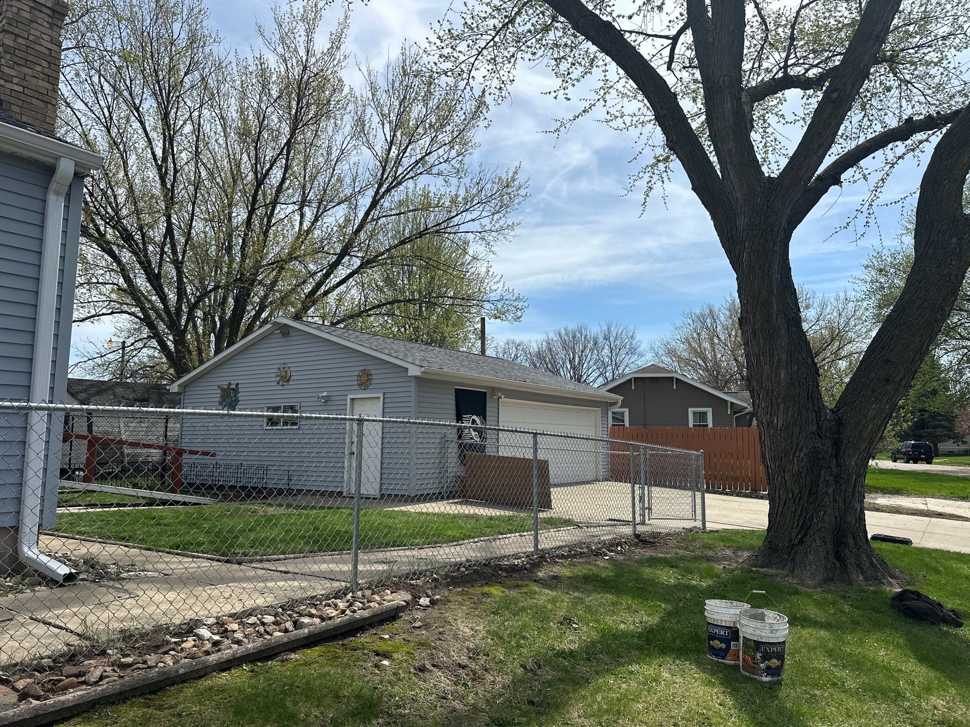 Black Chain Link Fence Installation for Waterloo Residential Backyard by Perfect Picket Fence and Stain