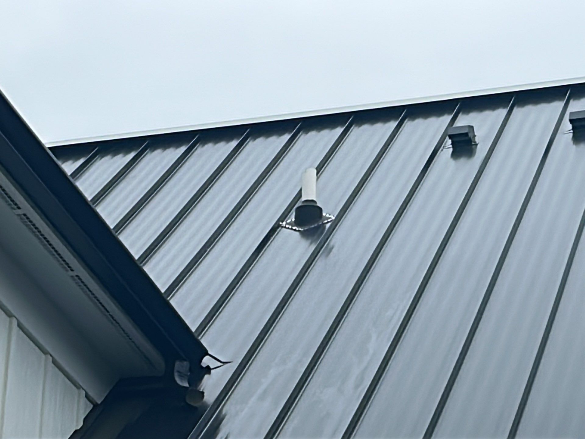 Residential Roofing Installation using Standing Seam Metal - Frost Black by RoofX 