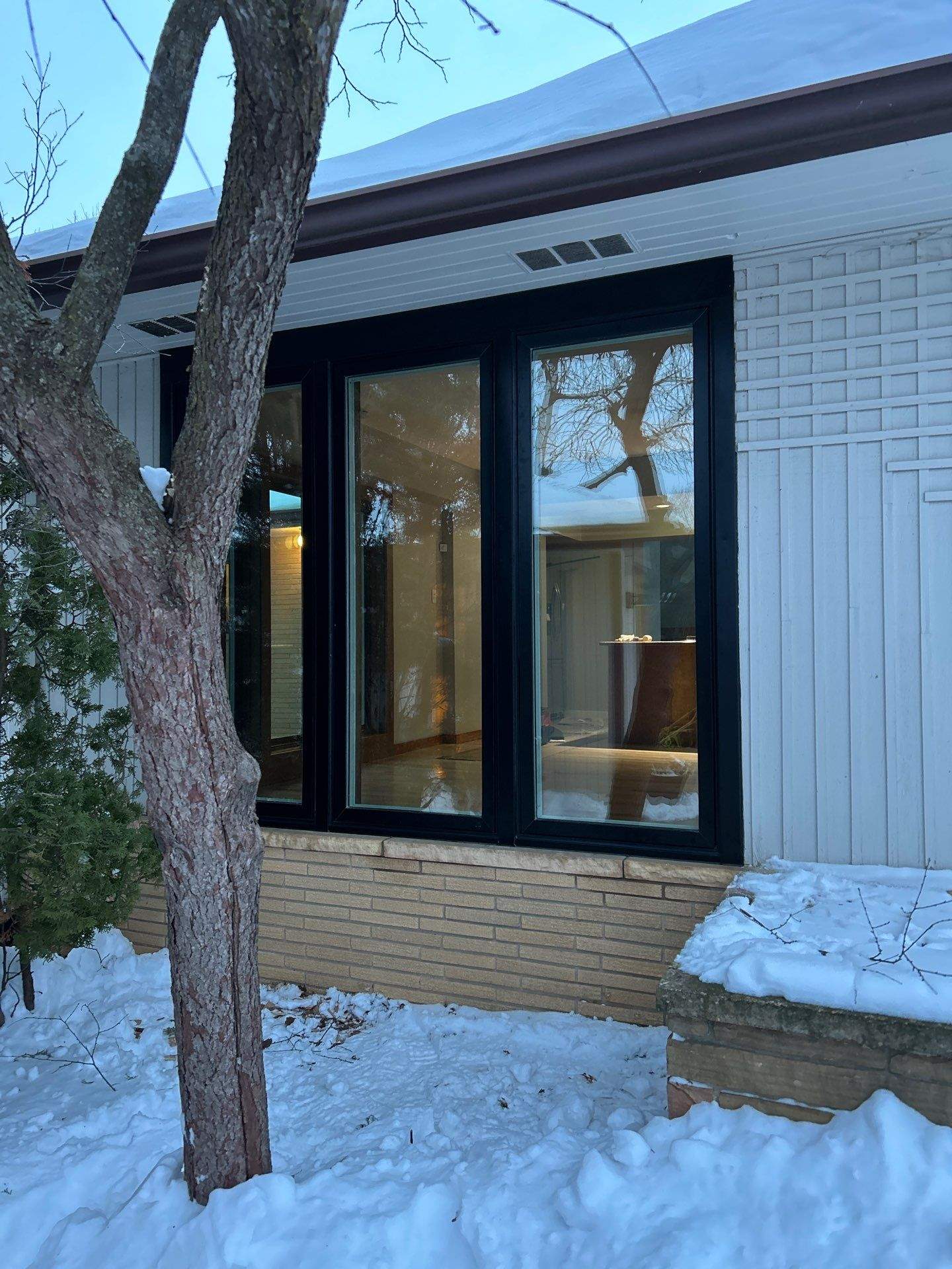 Black-Frame Pella Lifestyle Upgrade on a Partial Brick Home by United Windows and Siding LLC