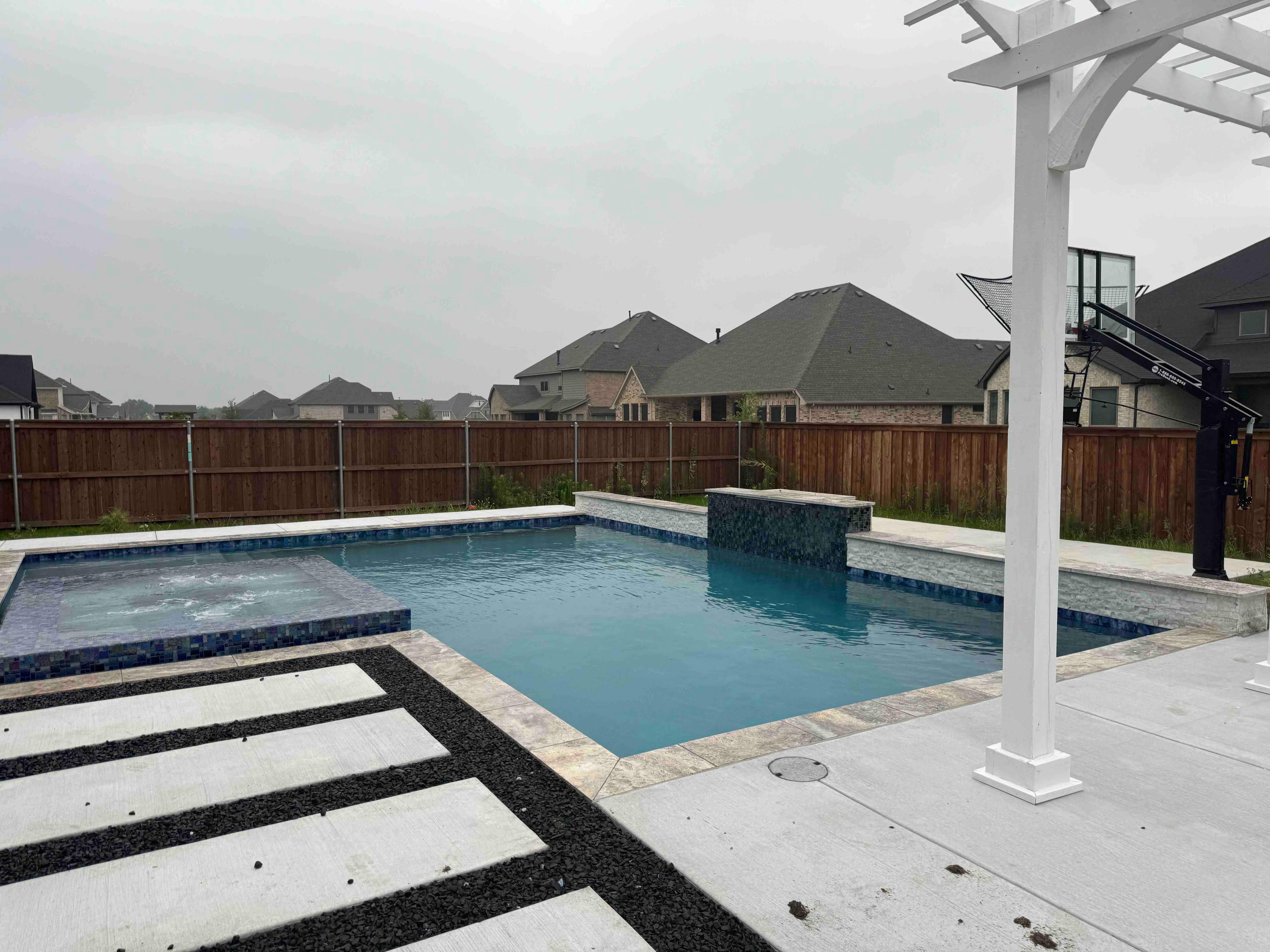 Geometric Pool with Raised Spa, Fire Pit and Pergola by Pinnacle Pools and Spas - DFW