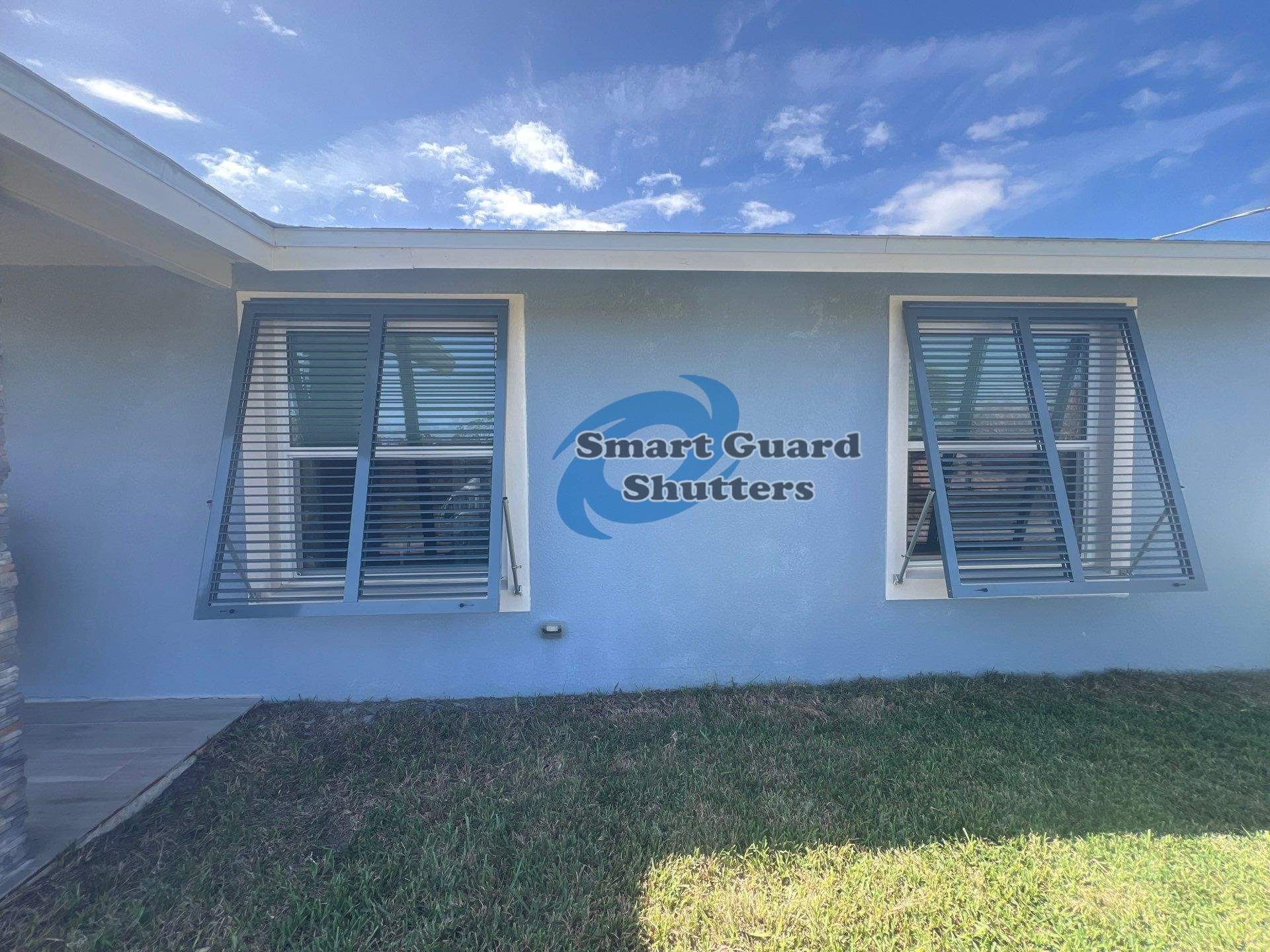 Impact Bahama Shutters in Grey Blue by Smart Guard Shutters