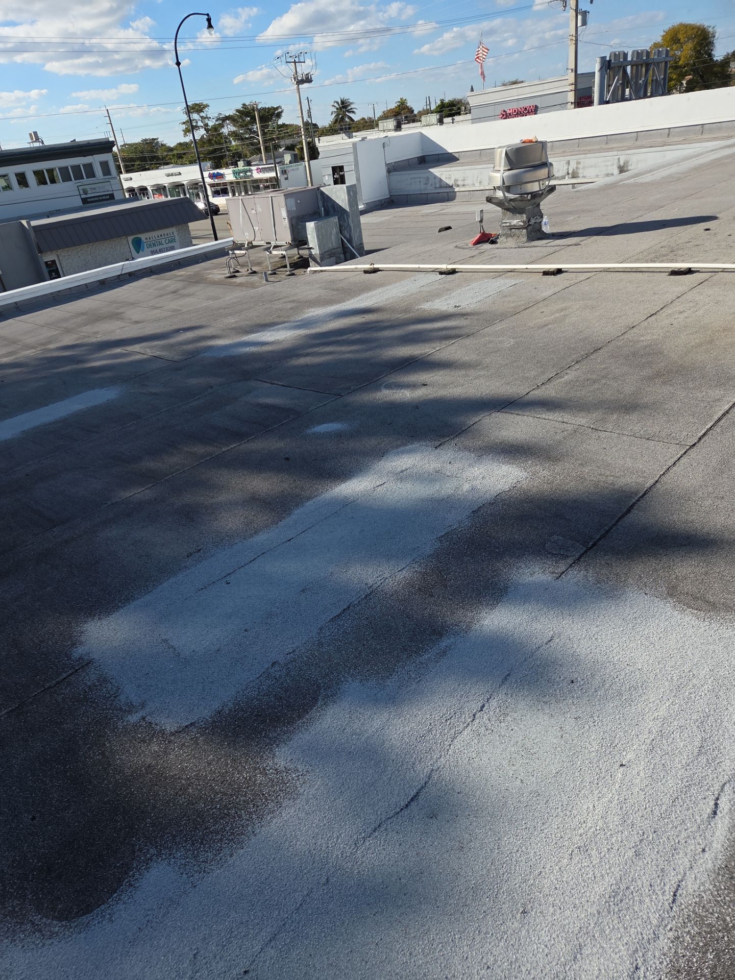 Commercial Flat Roof Restoration Using Silicone Coating in Hallandale Beach by Aastro Roofing