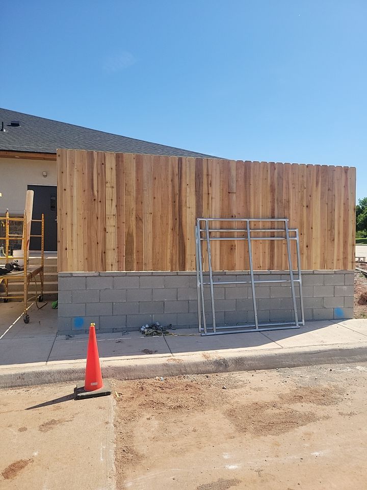 Cedar Fence using Cedar Pickets and Metal Poles by Clays Services Inc