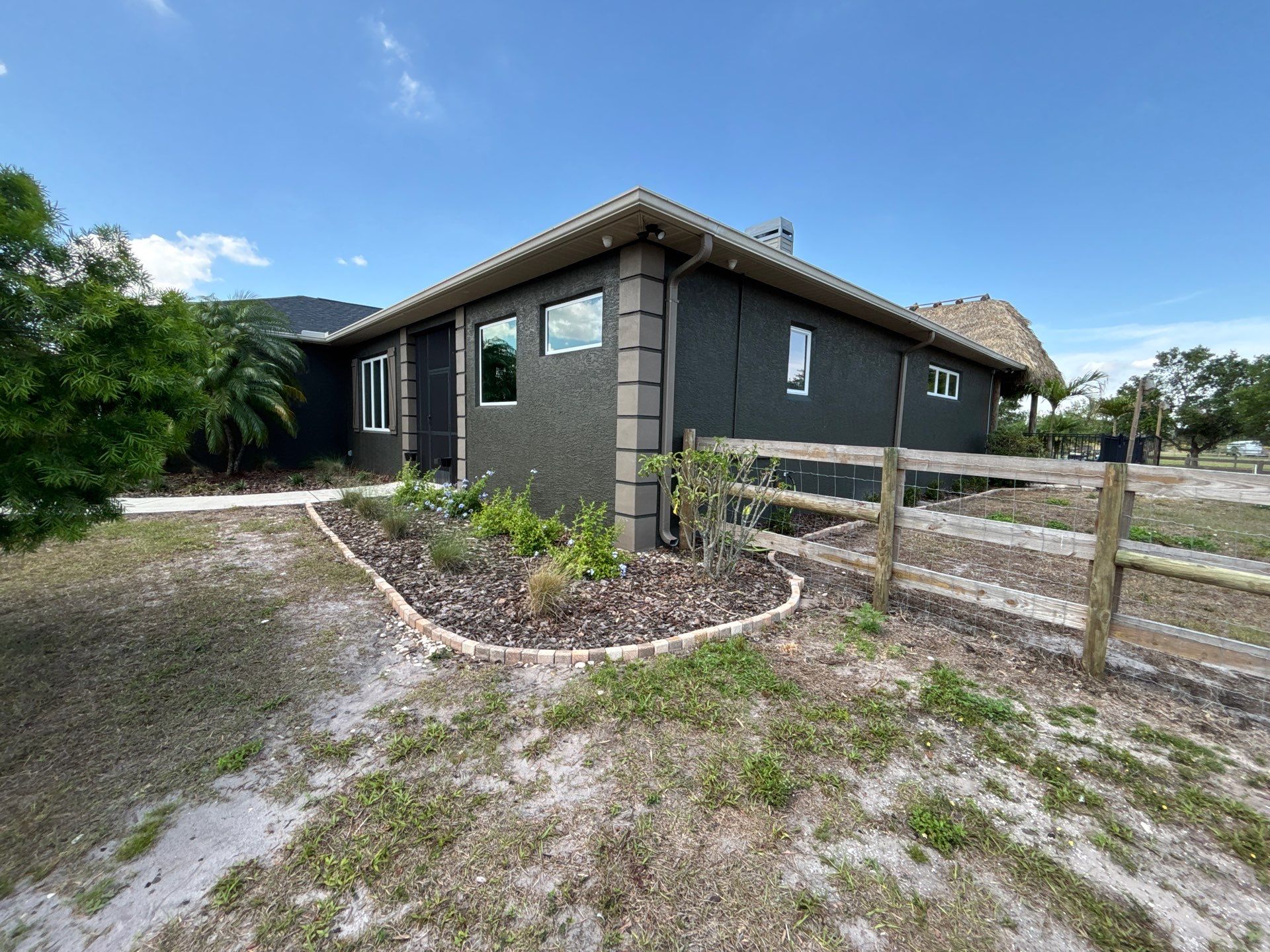  7-inch White seamless gutters and downspouts in Myakka City FL by Gutter Professors