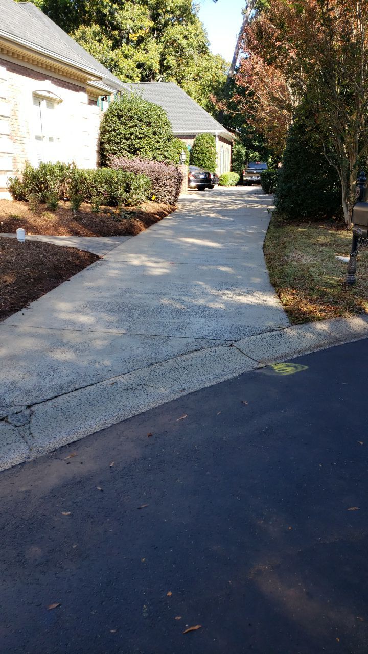 Driveway Clean using cleaner by Power Wash Masters LLC