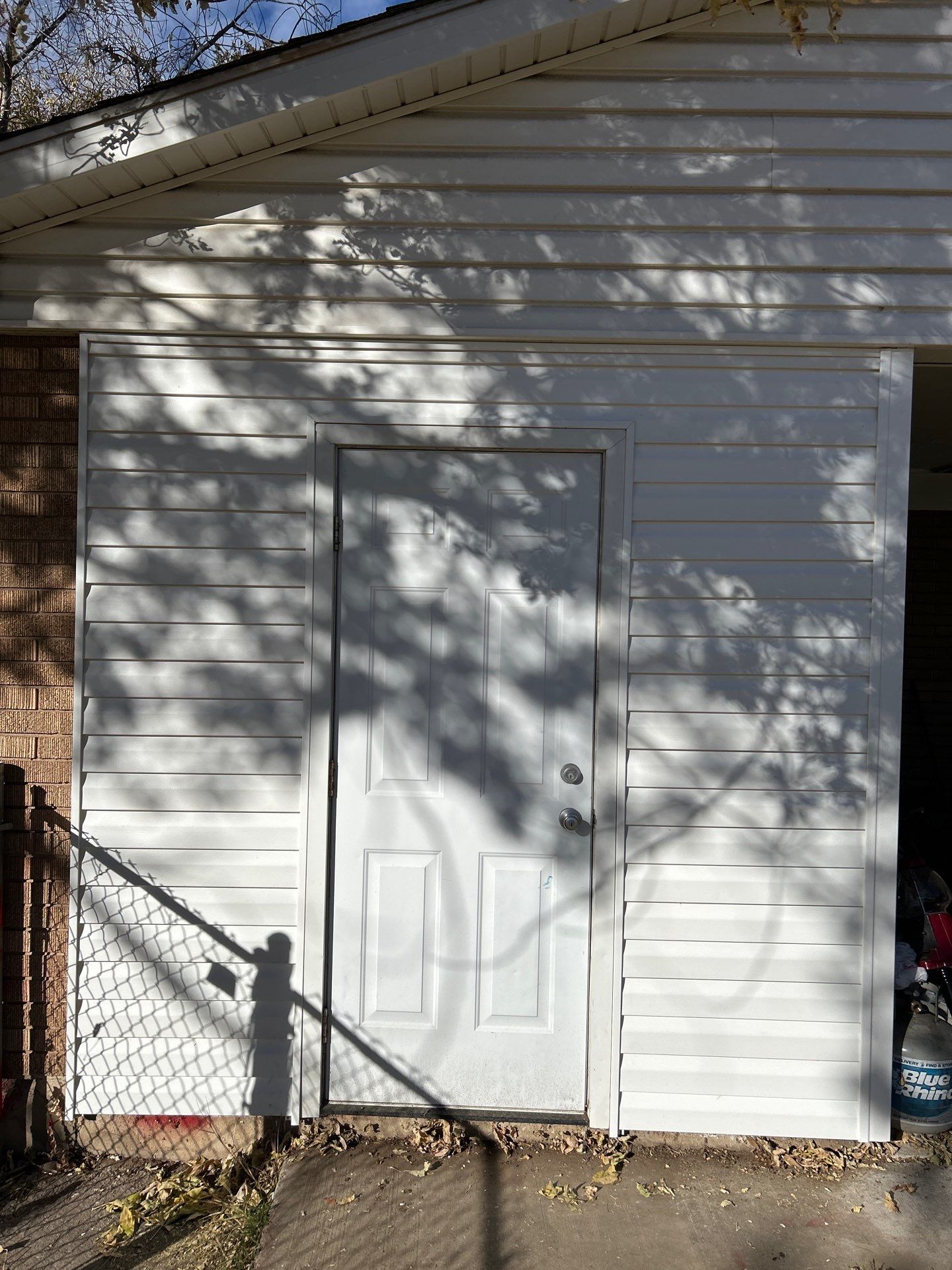 Salt Lake Area | Targeted Vinyl Siding & Door Trim Repair | Crisp White by Ideal Siding Utah