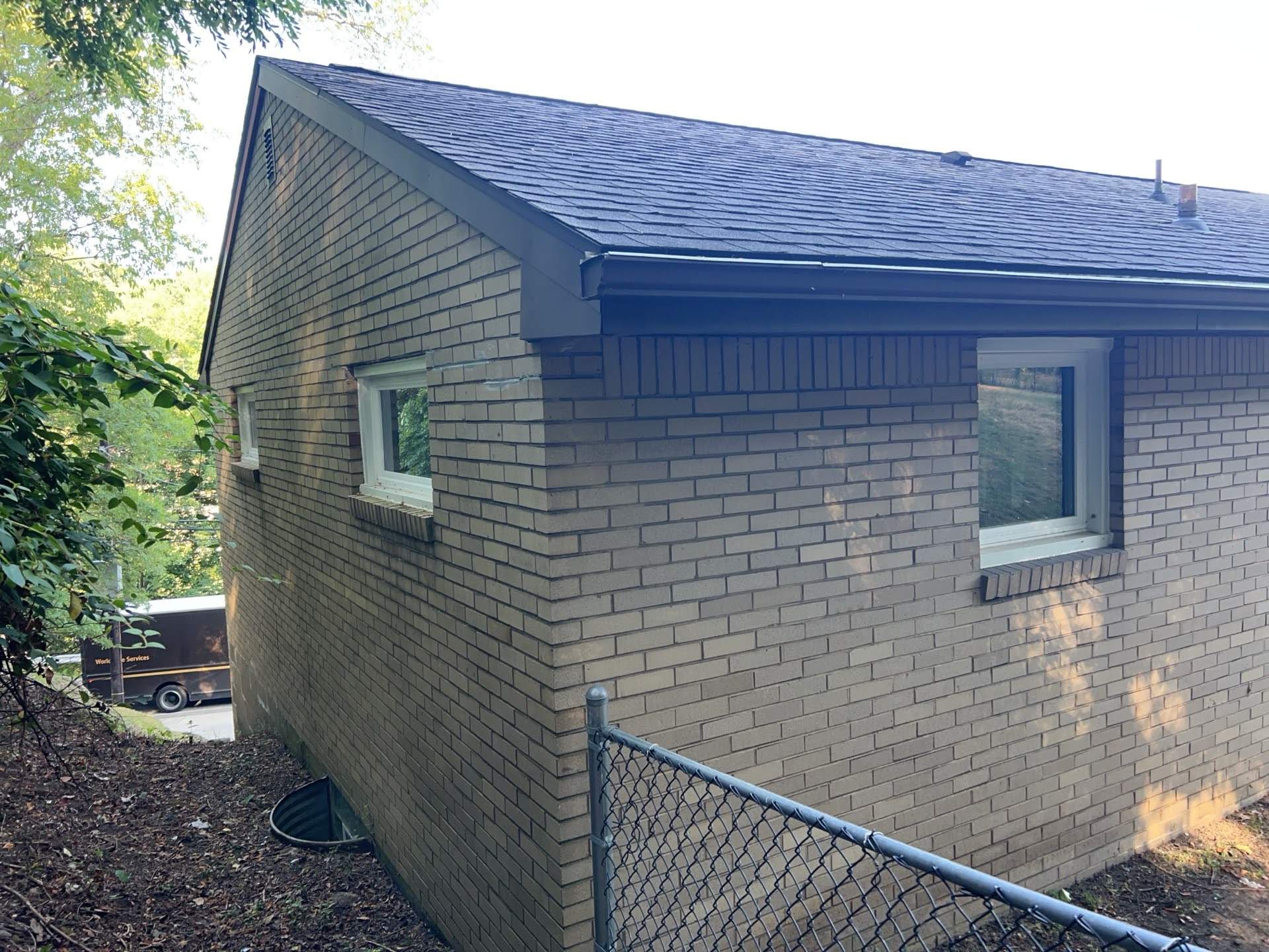 White Brick Exterior Painting and Dark Trim Transformation in Pittsburgh by Ideal Siding Pittsburgh