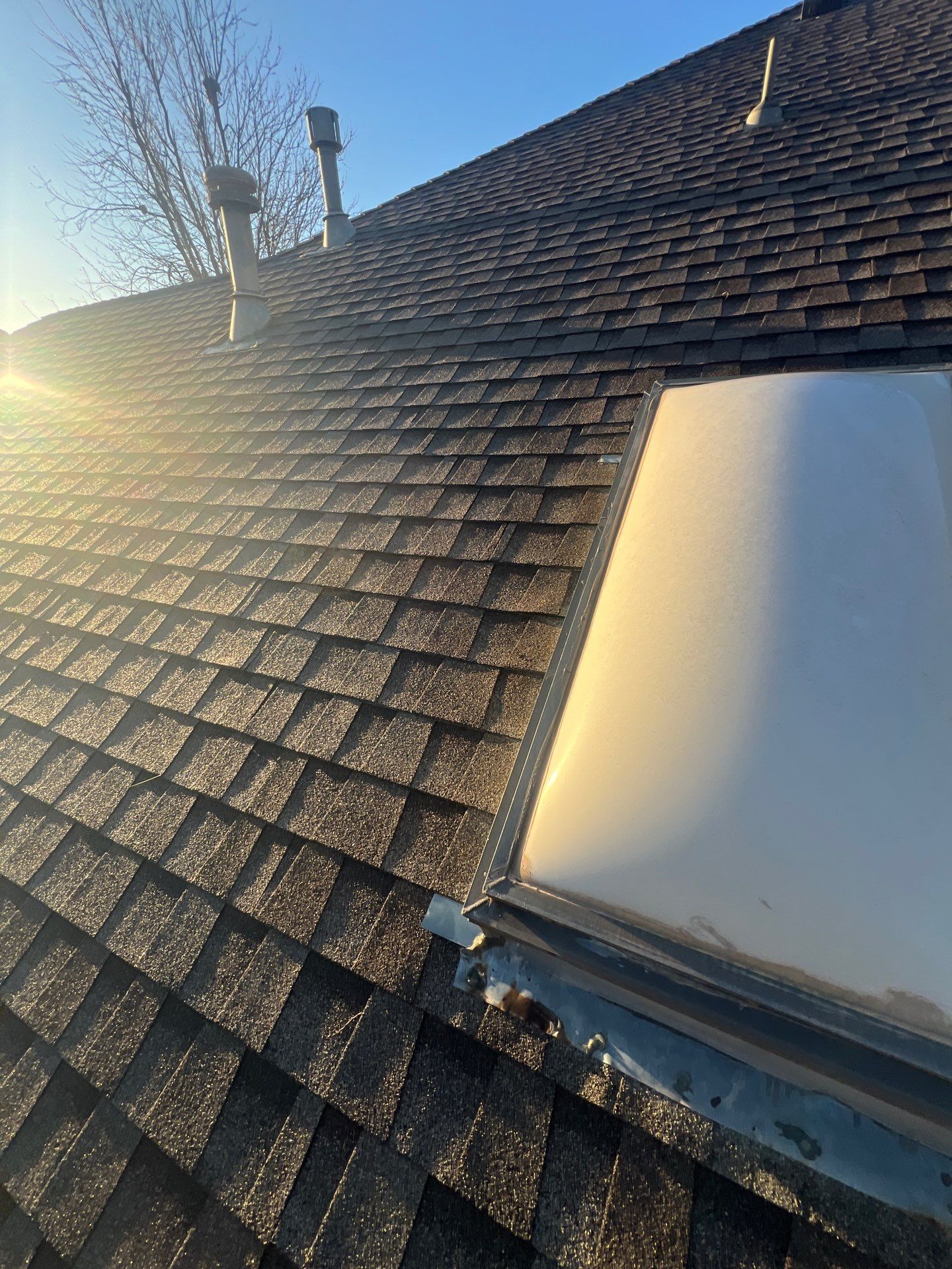 Roof Replacement & Skylight Project in Edmond, OK by McCann's Roofing and Construction