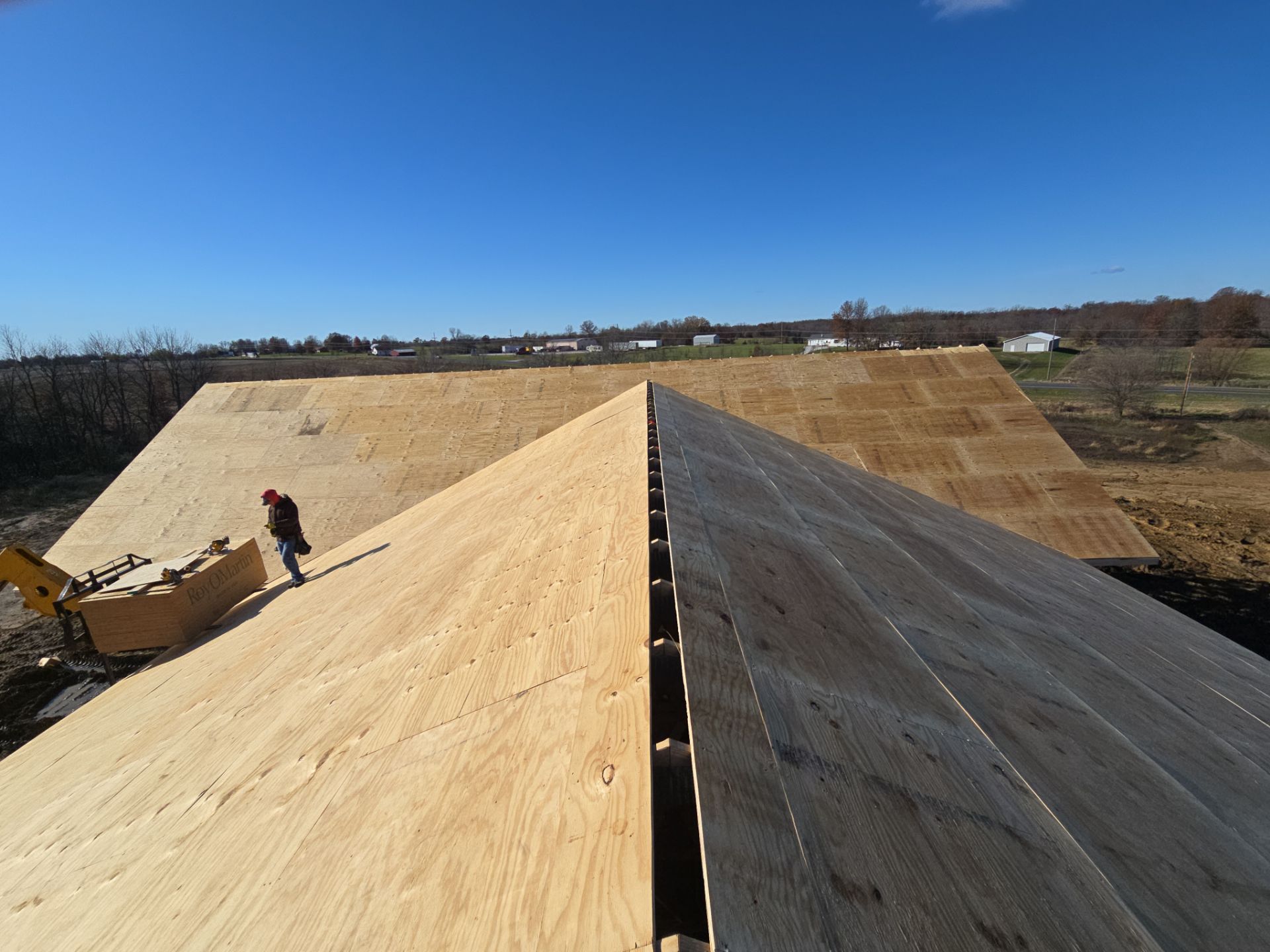 New Home construction w/ board and batten sides and metal roof  by Miles Construction 
