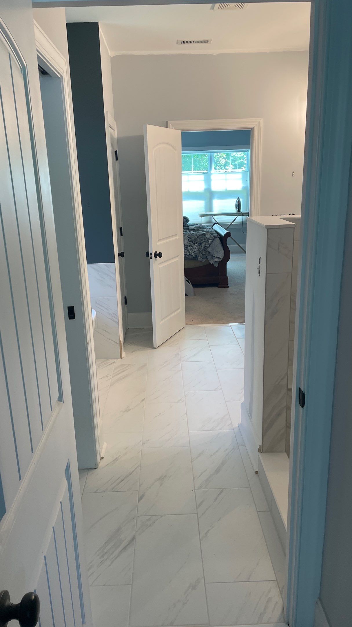 Bright Bathroom Remodel with Wall Removal, Stand Alone Tub and New Vanity by Footprints Floors of Coastal Carolina