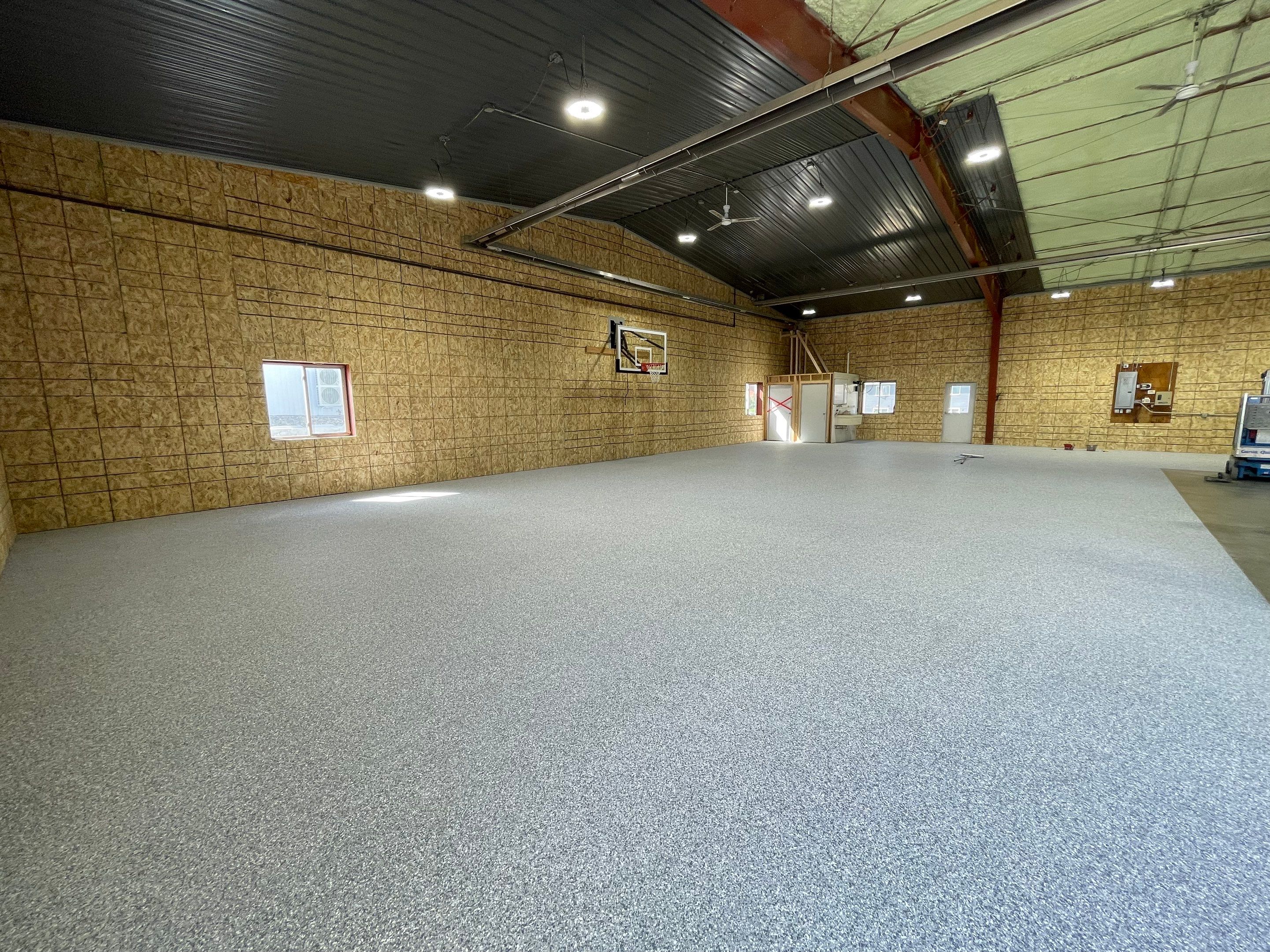 Custom Polyurea Shop Floor with Basketball Court Lines in Rock Valley by Select Painting, Coatings & Garage Cabinets