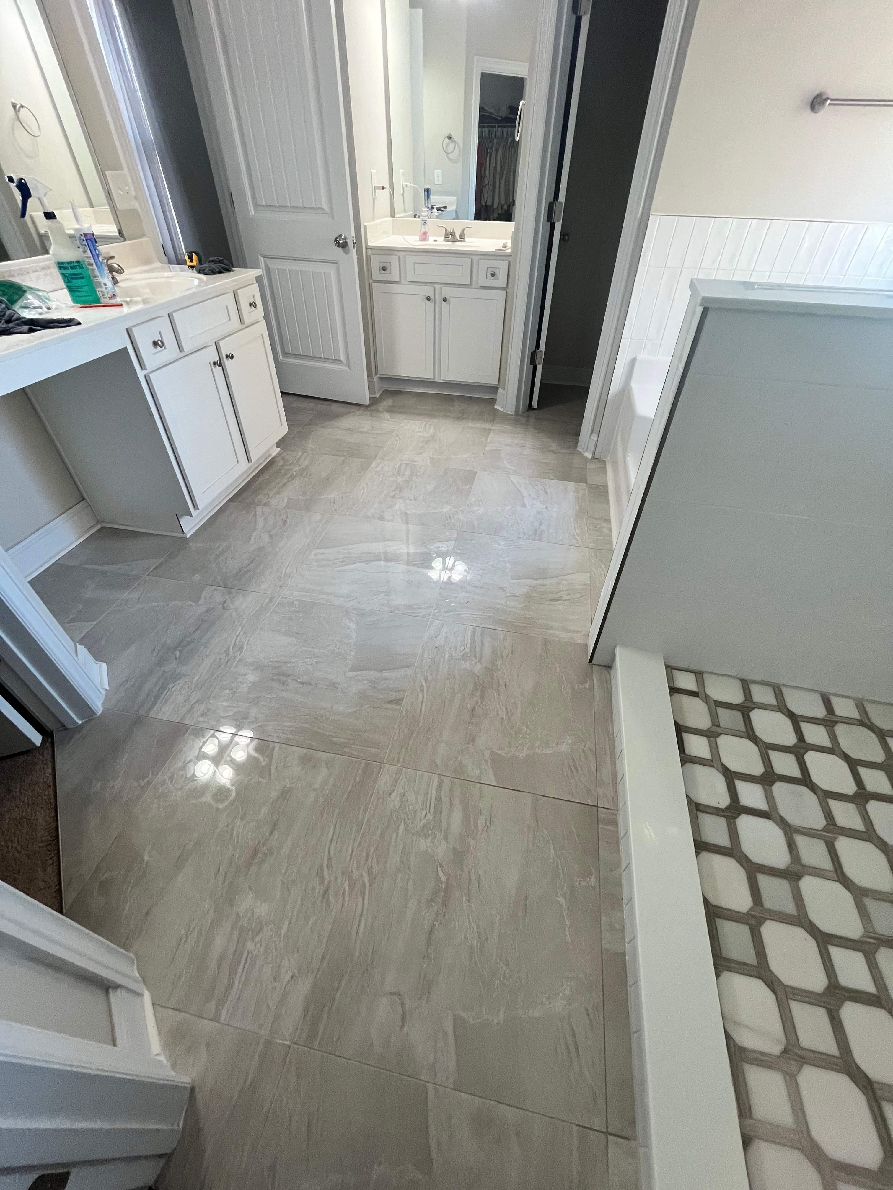 Shower retile and bathroom flooring by Prudencio