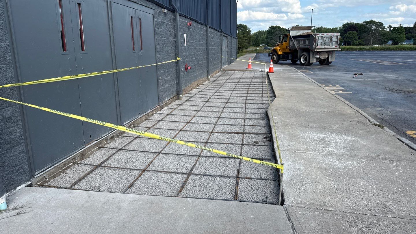 Broom finished concrete patio  by NG Masonry & Construction LLC