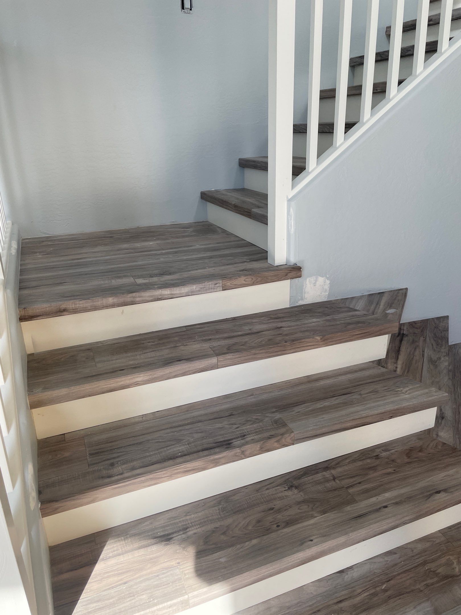 Laminate Staircase and Flooring  by Footprints Floors of Chandler 