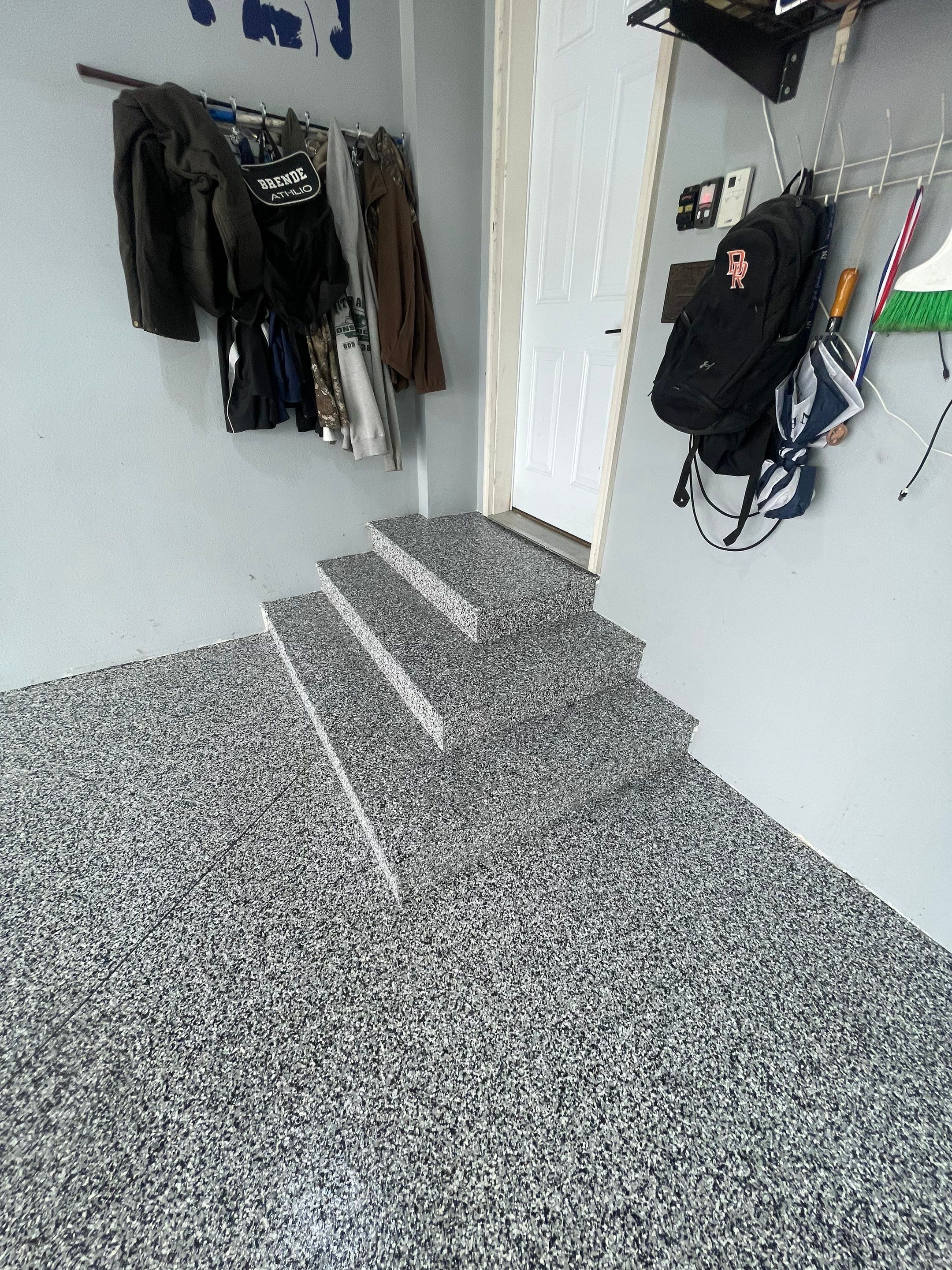 Full Garage Floor Epoxy Coating Installation in Dell Rapids by Select Painting, Coatings & Garage Cabinets