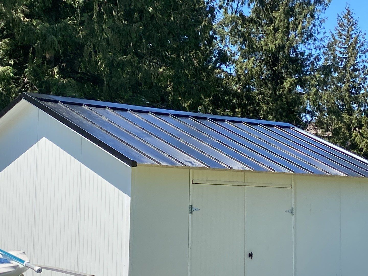 Residential shed roofed using 12" Prolok metal  by Top Notch Roofing Inc