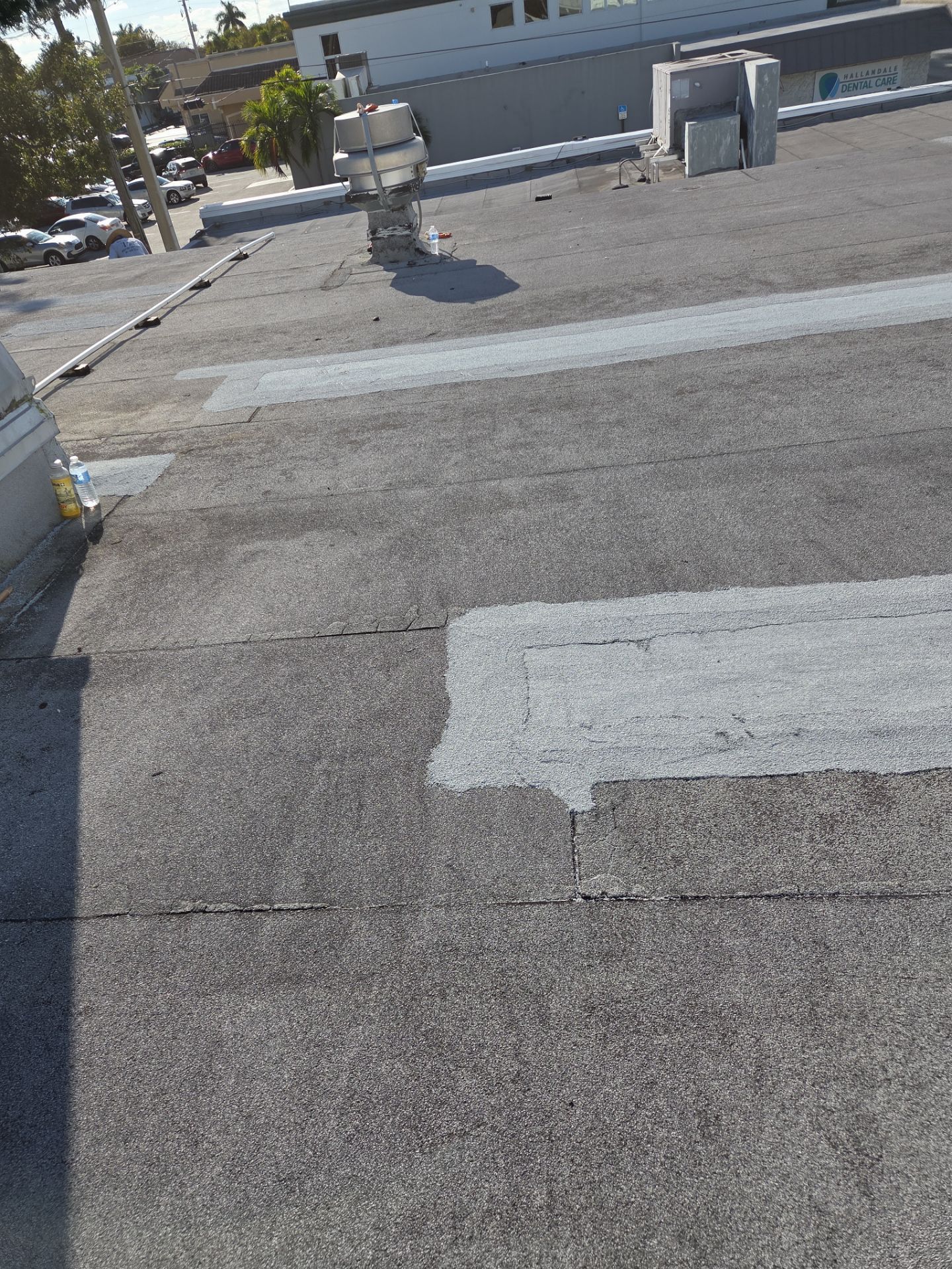 Commercial Flat Roof Restoration Using Silicone Coating in Hallandale Beach by Aastro Roofing