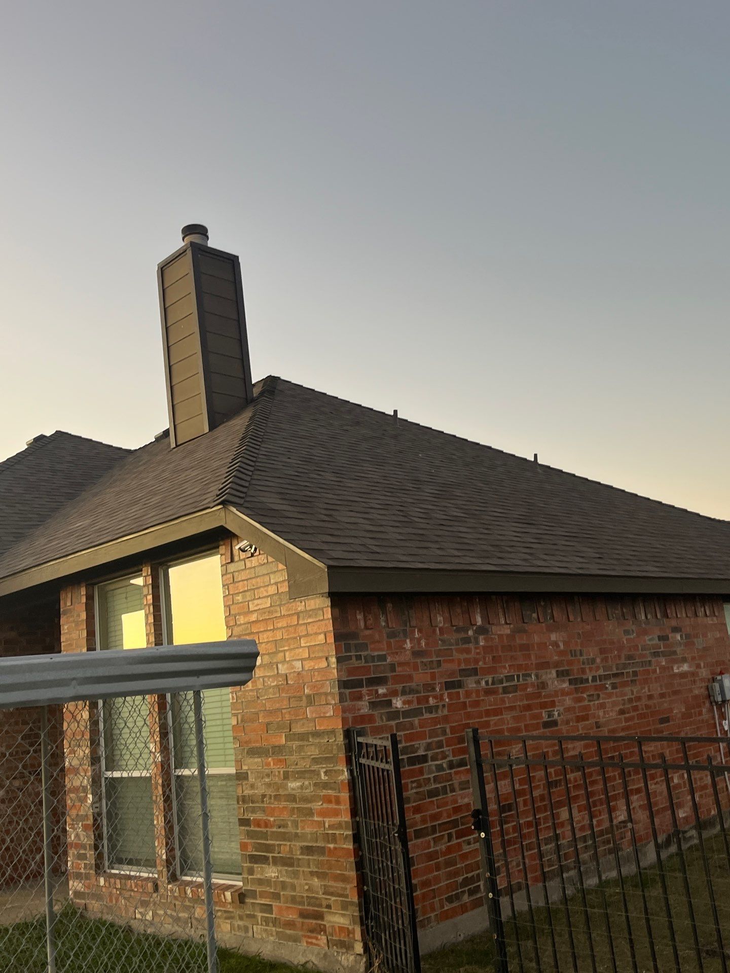 Brick with Malarkey Natural Wood by Tejas Roofworks + Restoration