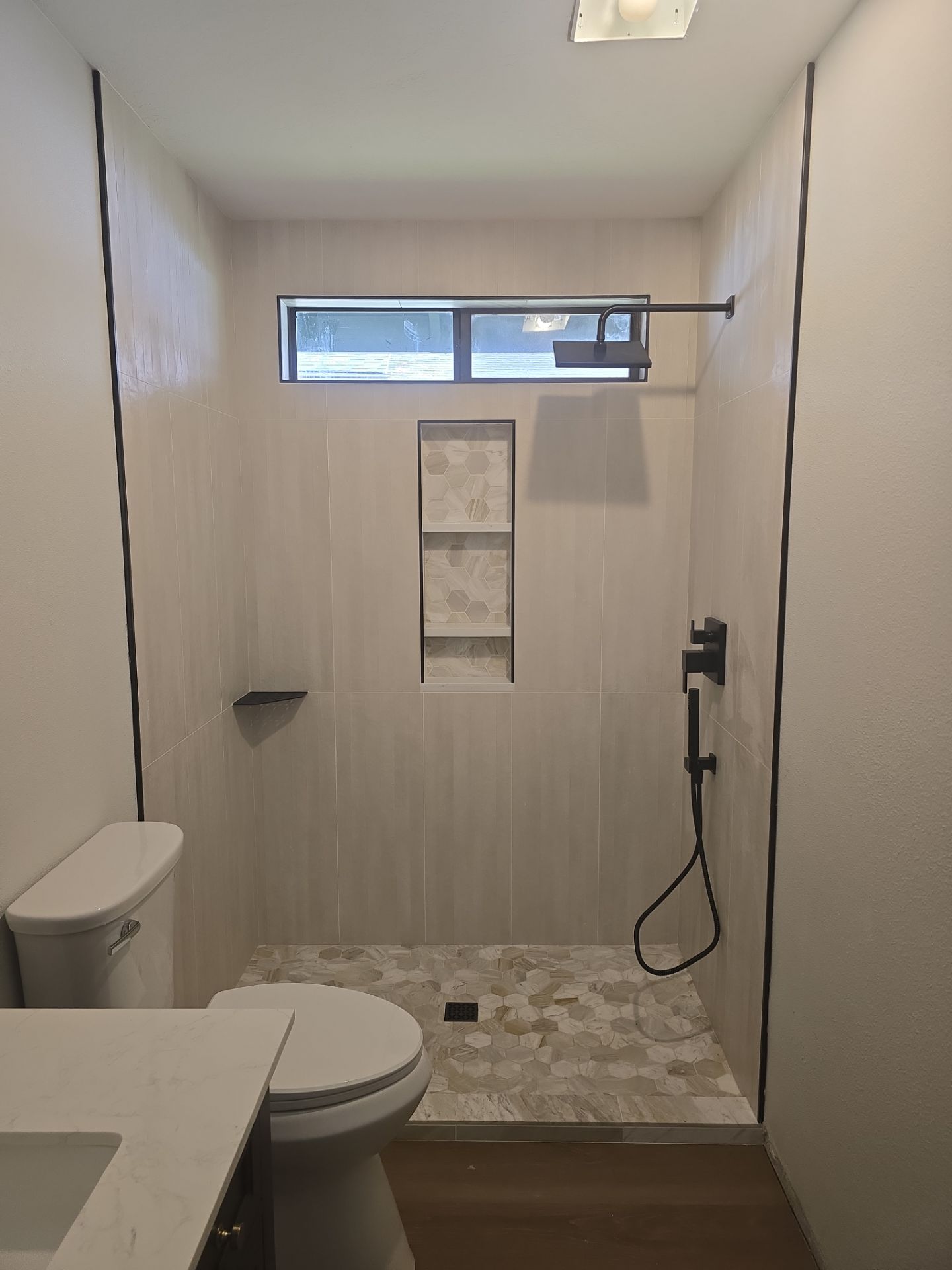 Full Interior Renovation Featuring Custom Tile Shower and Fireplace in Brookings by KMD Surfaces INC.