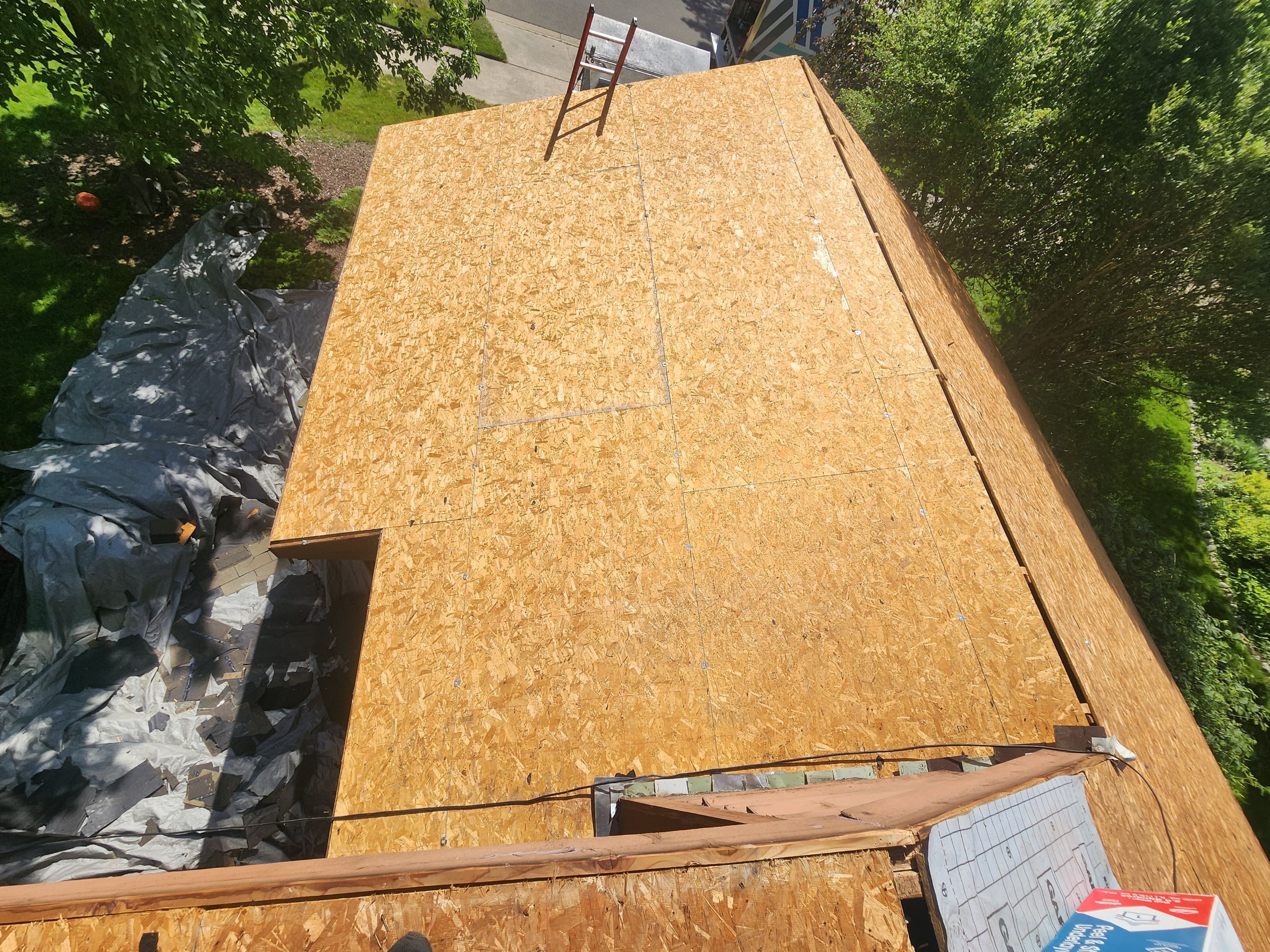 Installing new Roof and Gutter Protection after Hail Damage by Acme Exteriors