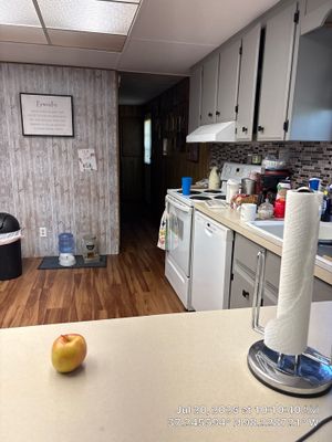 Kitchen Remodel Featuring Gray Cabinets and Laminate Flooring in Attica