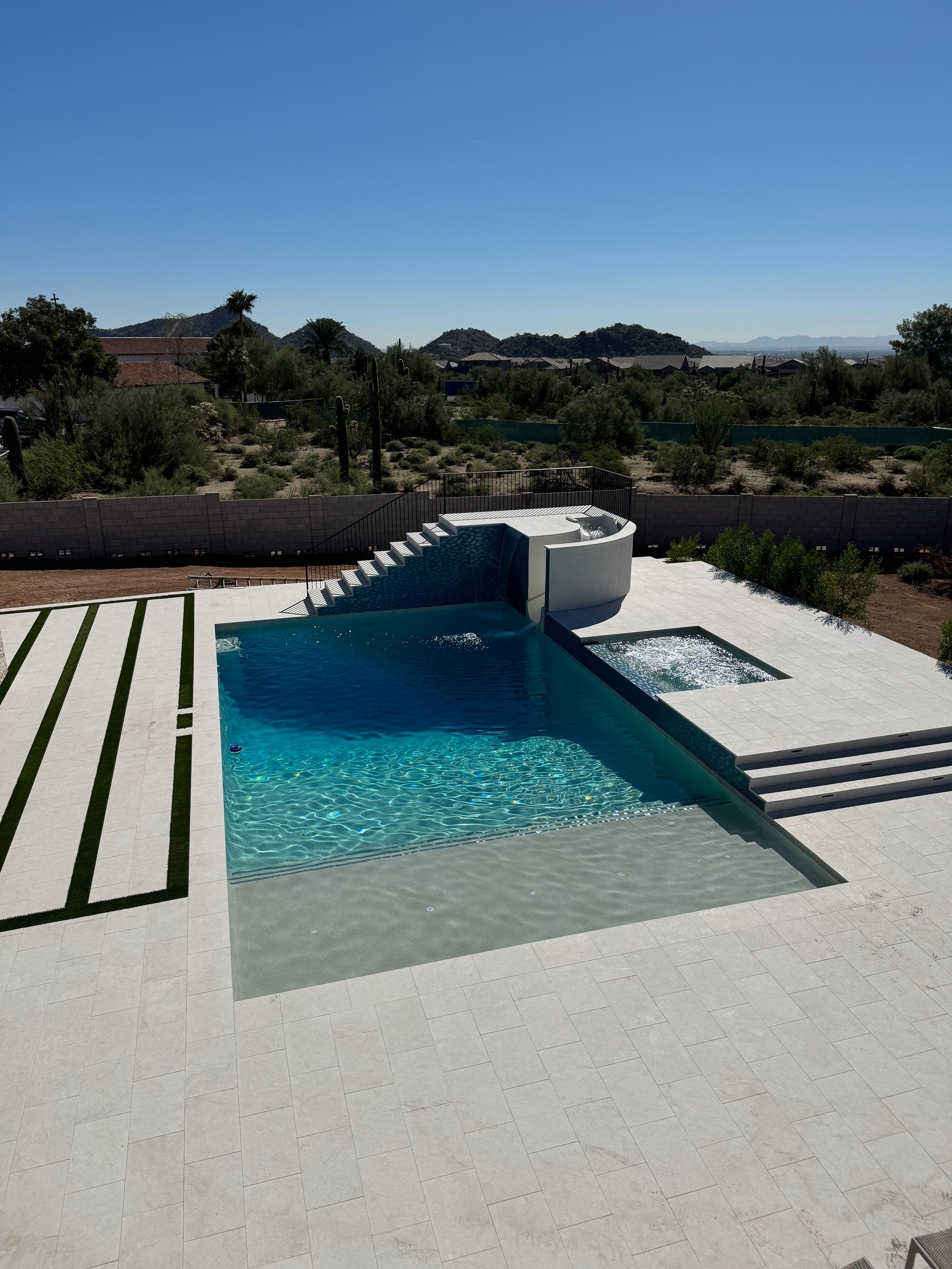 Pool and spa build with slide & outdoor kitchen by Modern Pools
