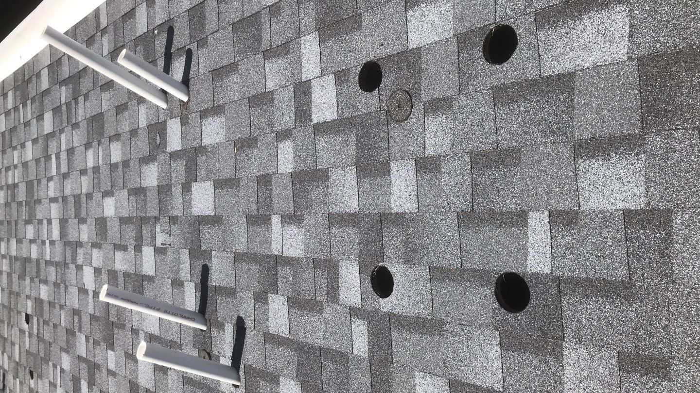 Commercial Roofing Installation using EPDM with white gutters by A Plus Exterior