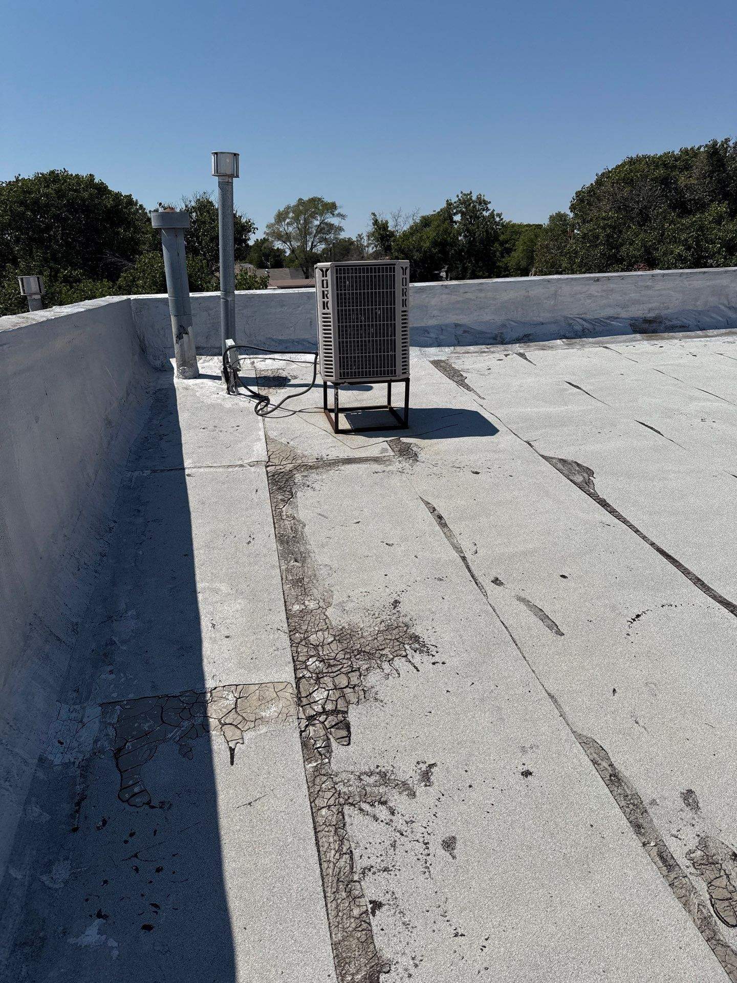 Hollis High School Comprehensive TPO Roof Replacement and Restoration by Secondary Rhodes