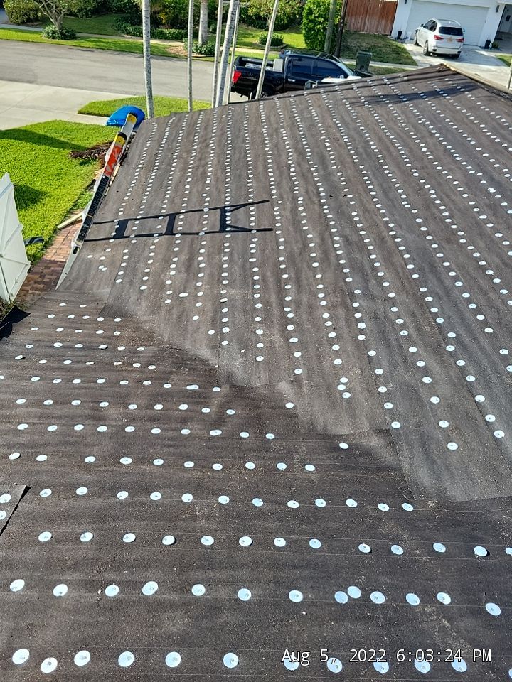 Residential Roofing Installation using 1" Nail strip metal roof by BLUES BROTHERS ROOFING