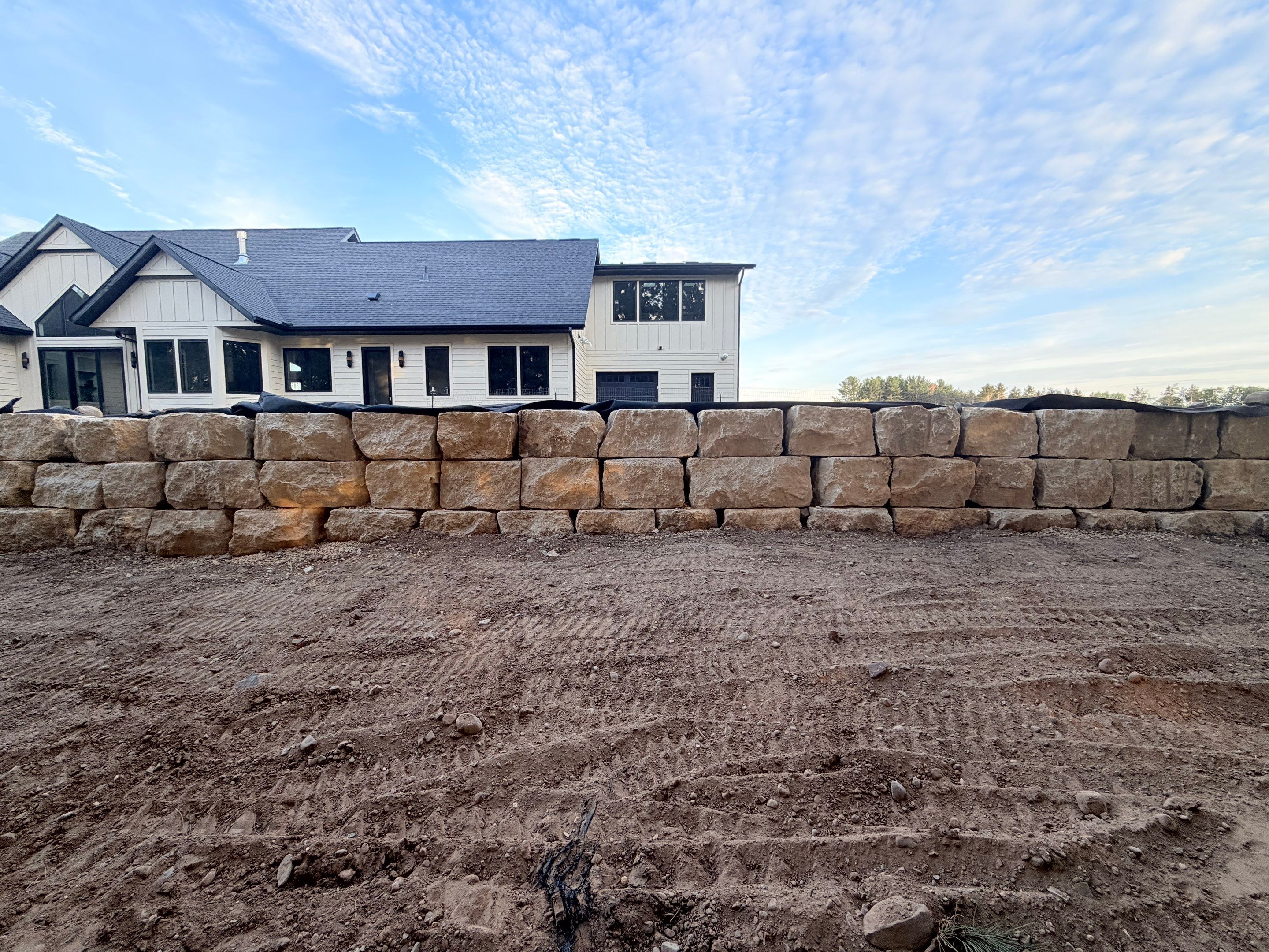 Limestone Boulder Wall by Sota landscaping
