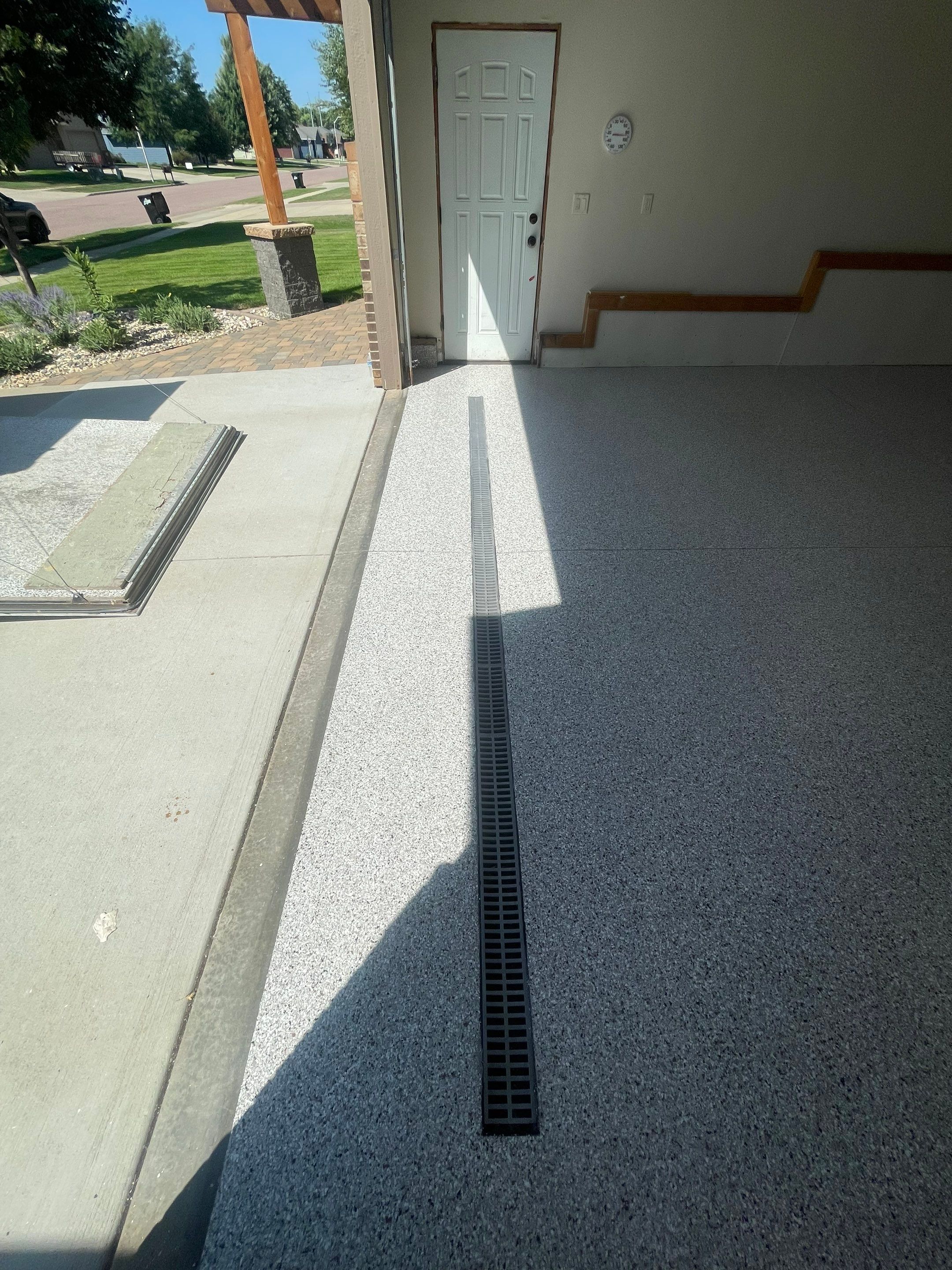 Multi-Stall Garage Floor Coating Installation in Sioux Falls by Select Painting, Coatings & Garage Cabinets