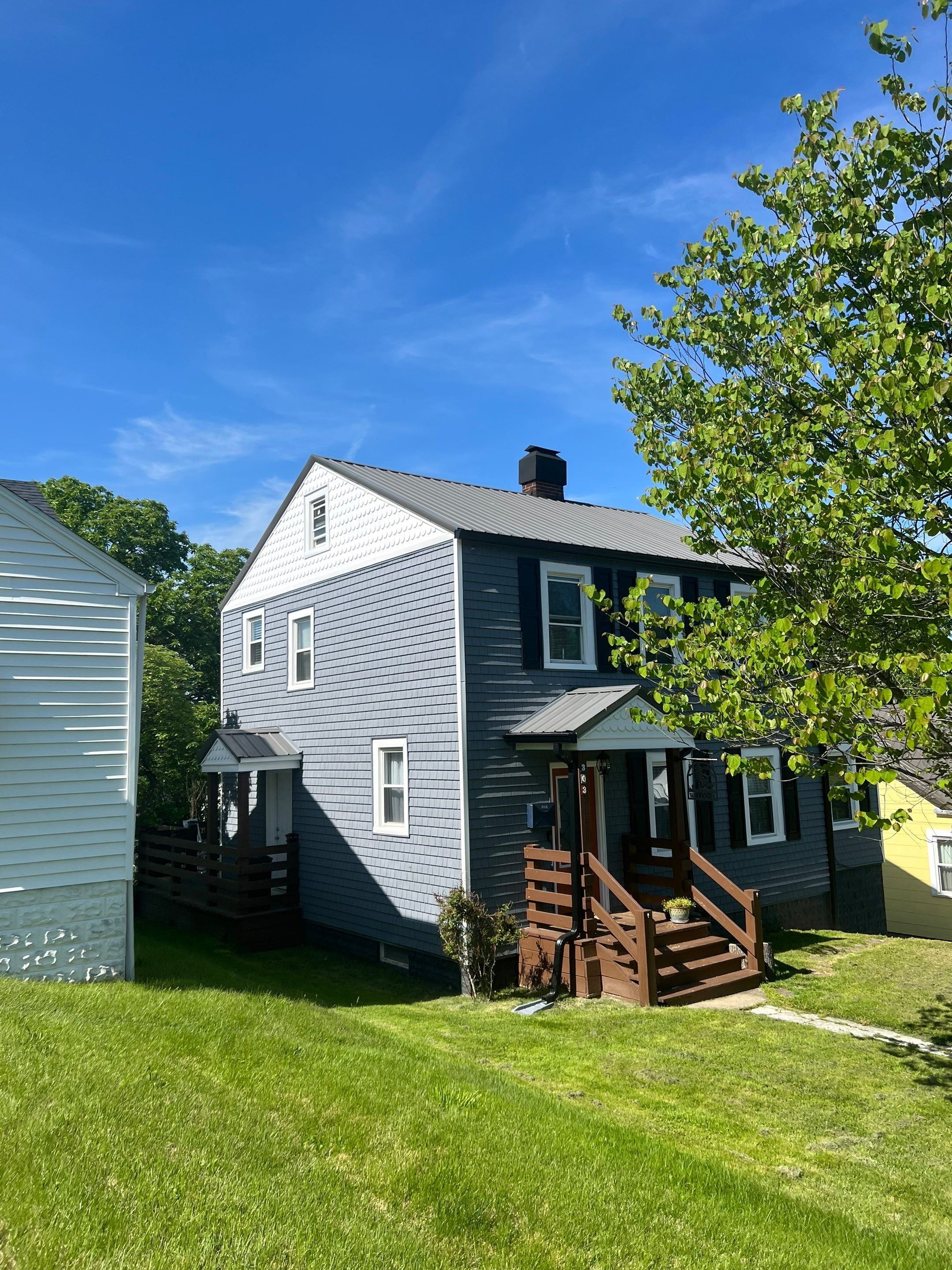 Siding Installation using Exterior Portfolio Portsmouth Vinyl Cedar Shakes by Secure Construction Company Inc