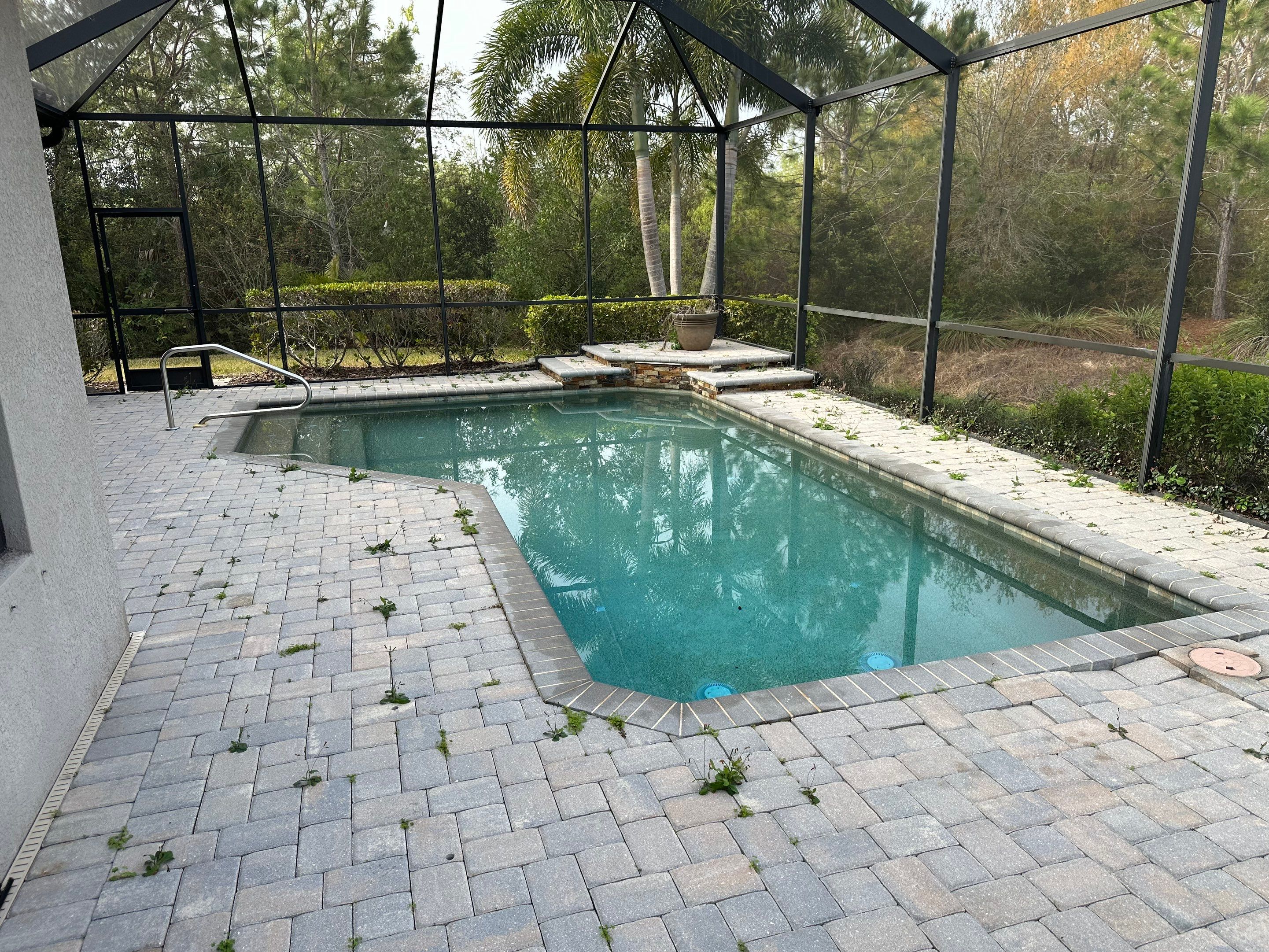 Concrete Tile Roof, Paver Pool Deck, Screen Enclosure & Driveway Cleaning in Artisan Lakes Esplanade, Palmetto, FL | Sunshine AquaWash by Sunshine AquaWash