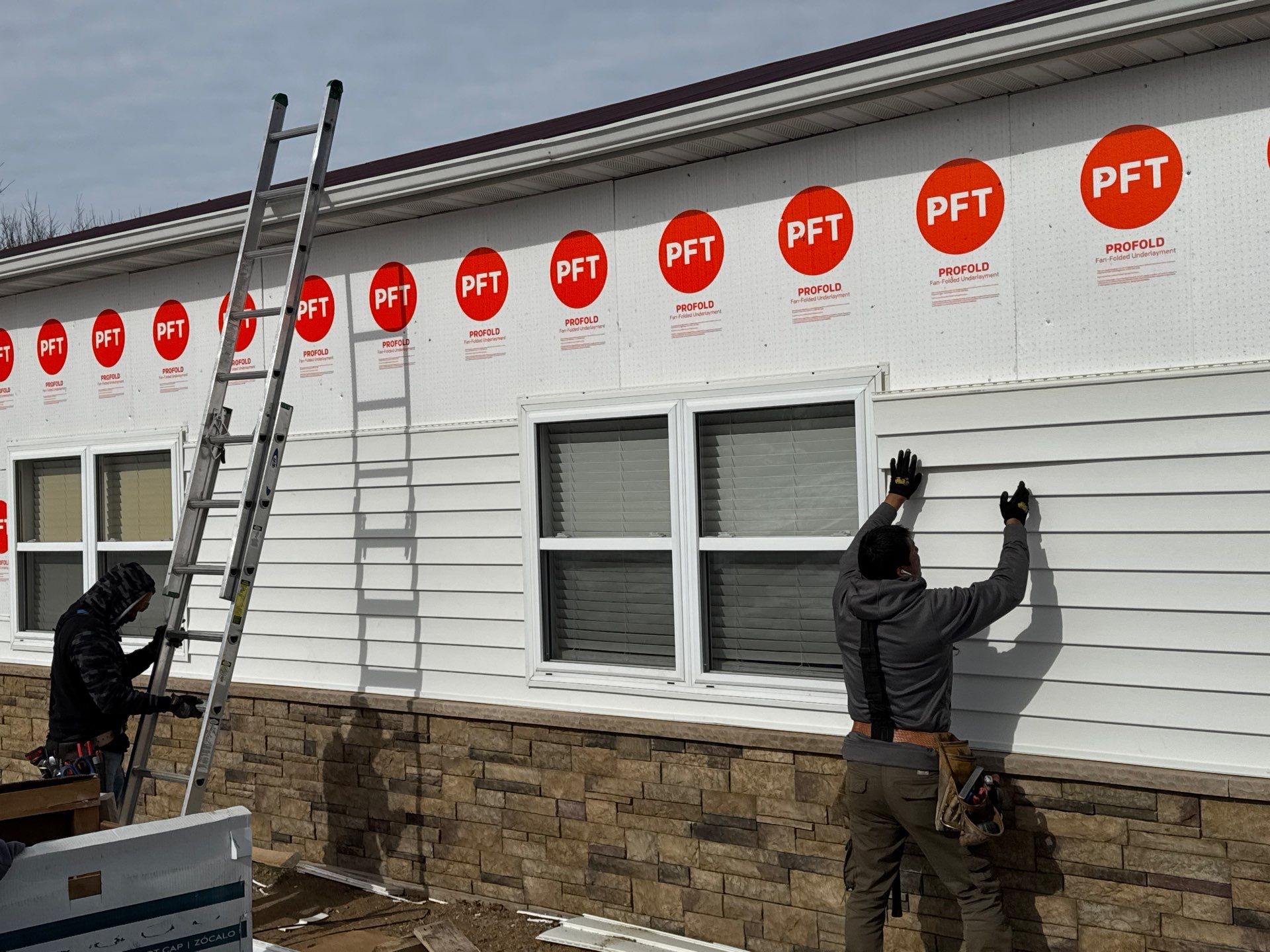 Siding and Stone Installation using Extrerior Porfolio Vinyl Siding and Versetta Stone by EEC  Windows, Siding & Roofing 