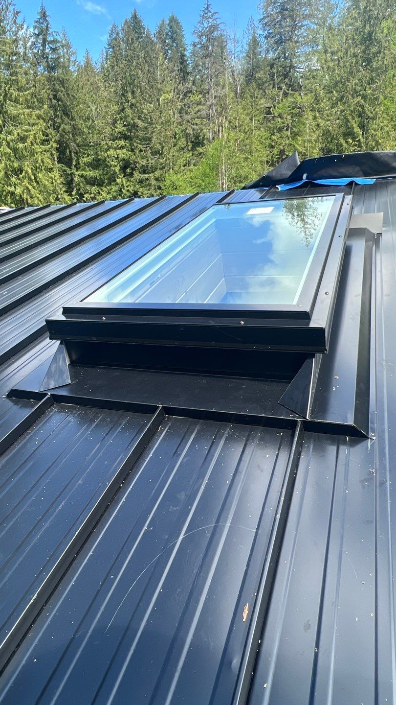 Residential ReRoofing Installation using 12" Prolok metal by Top Notch Roofing Inc