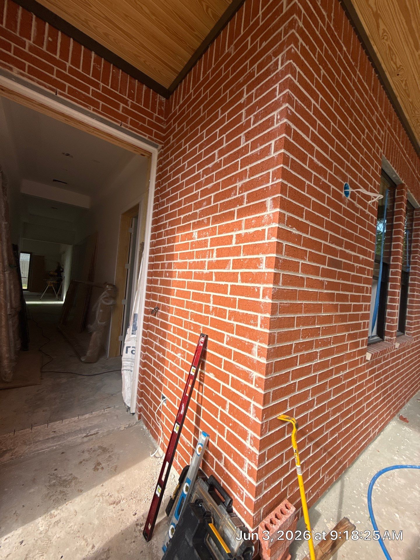 Midtown Elegance: Brickwork with Slurry Finish Refinement by Apex Conventional Stucco Llc