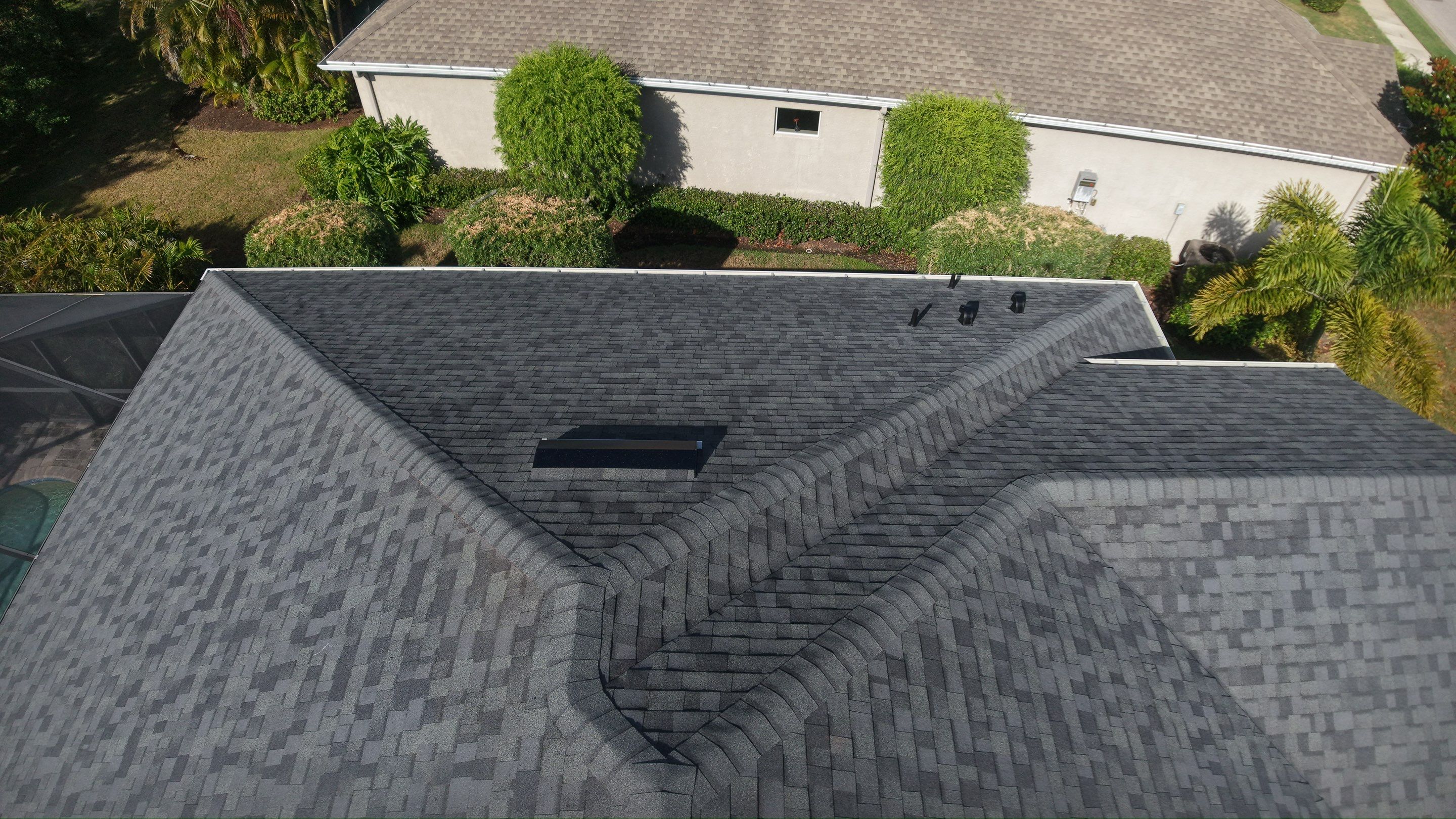 Residential Roof Installation With Estate Grey Architectural Shingles in Bradenton by Trinity Restoration and Roofing LLC