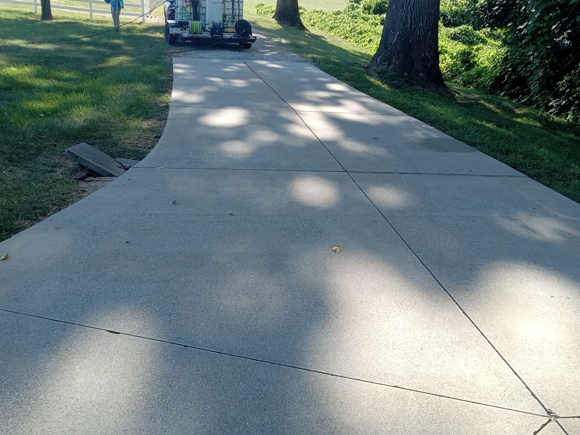 pressure washing company cleaning concrete sidewalk removing dirt grime for a refreshed look